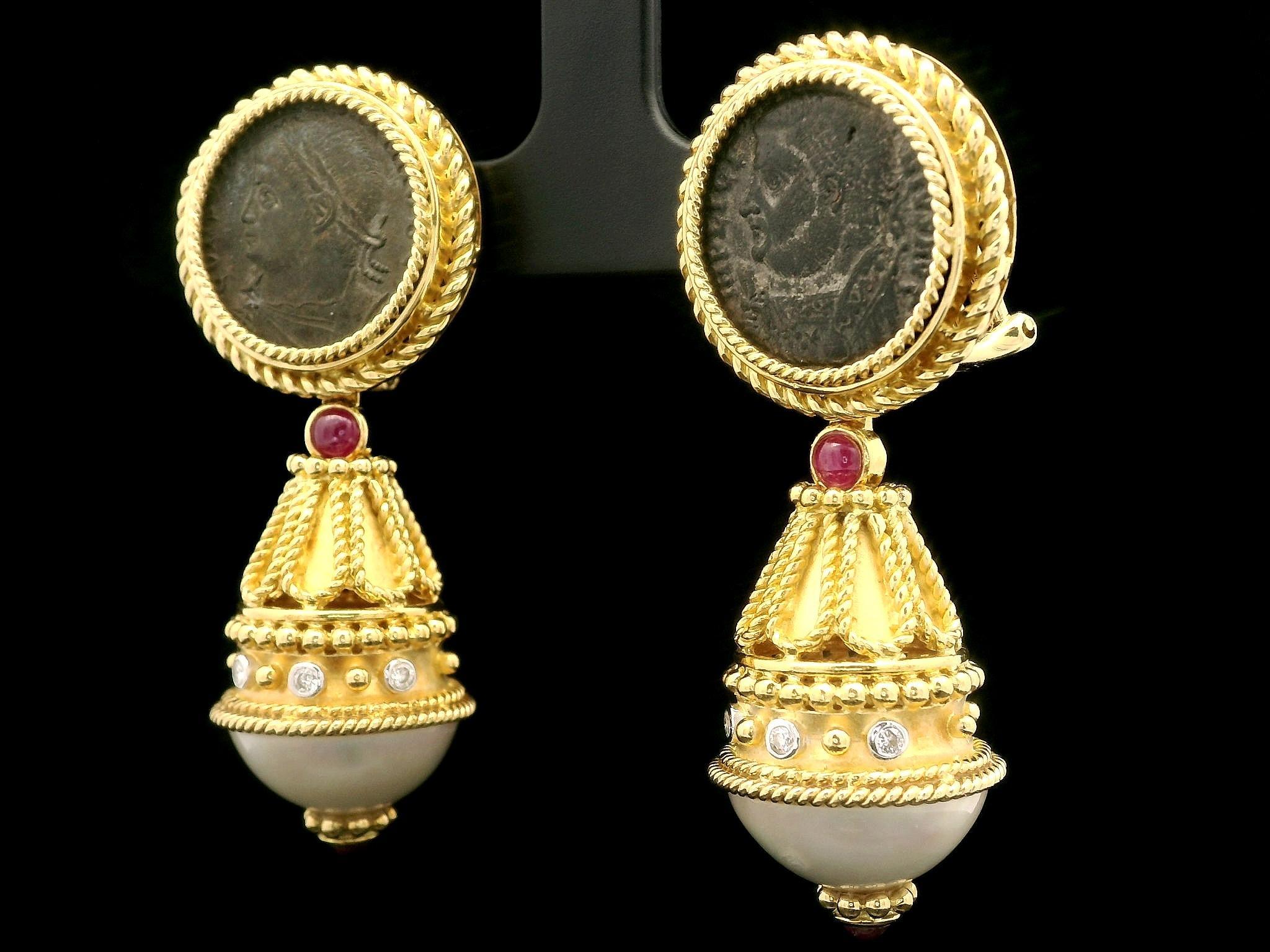 --Stone(s):--
(2) Ancient Coins - Round Shape - Bezel Set - Brownish Gray in Color - 15.5mm (approx.)
(2) Cultured Mabe Pearls - Round Shape - White Color w/ Pink Overtone - 15.1mm each (approx.)
(4) Natural Genuine Rubies - Round Cabochon Cut -