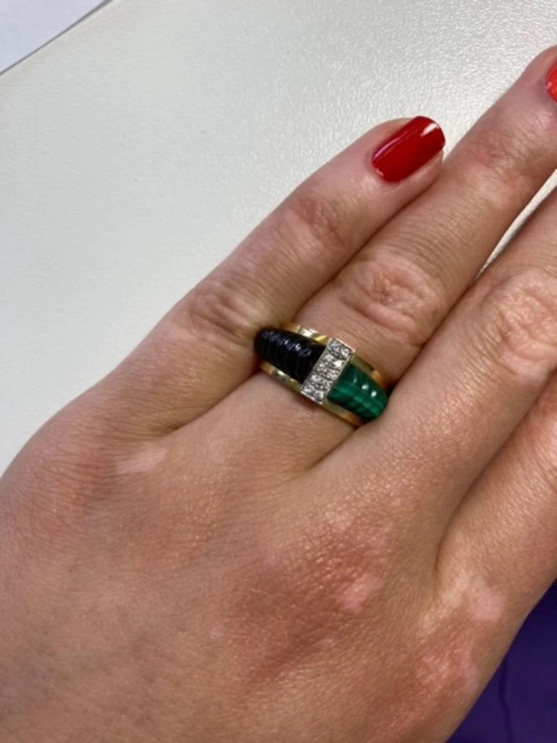 Vintage 18k Gold Malachite and Onyx Ring with Diamonds, One-of-a-kind

This vintage ring from the 1980s is a perfect statement piece. It has an onyx and beautiful leaf-green malachite stone set in 18k yellow gold with white diamond detail. Made to