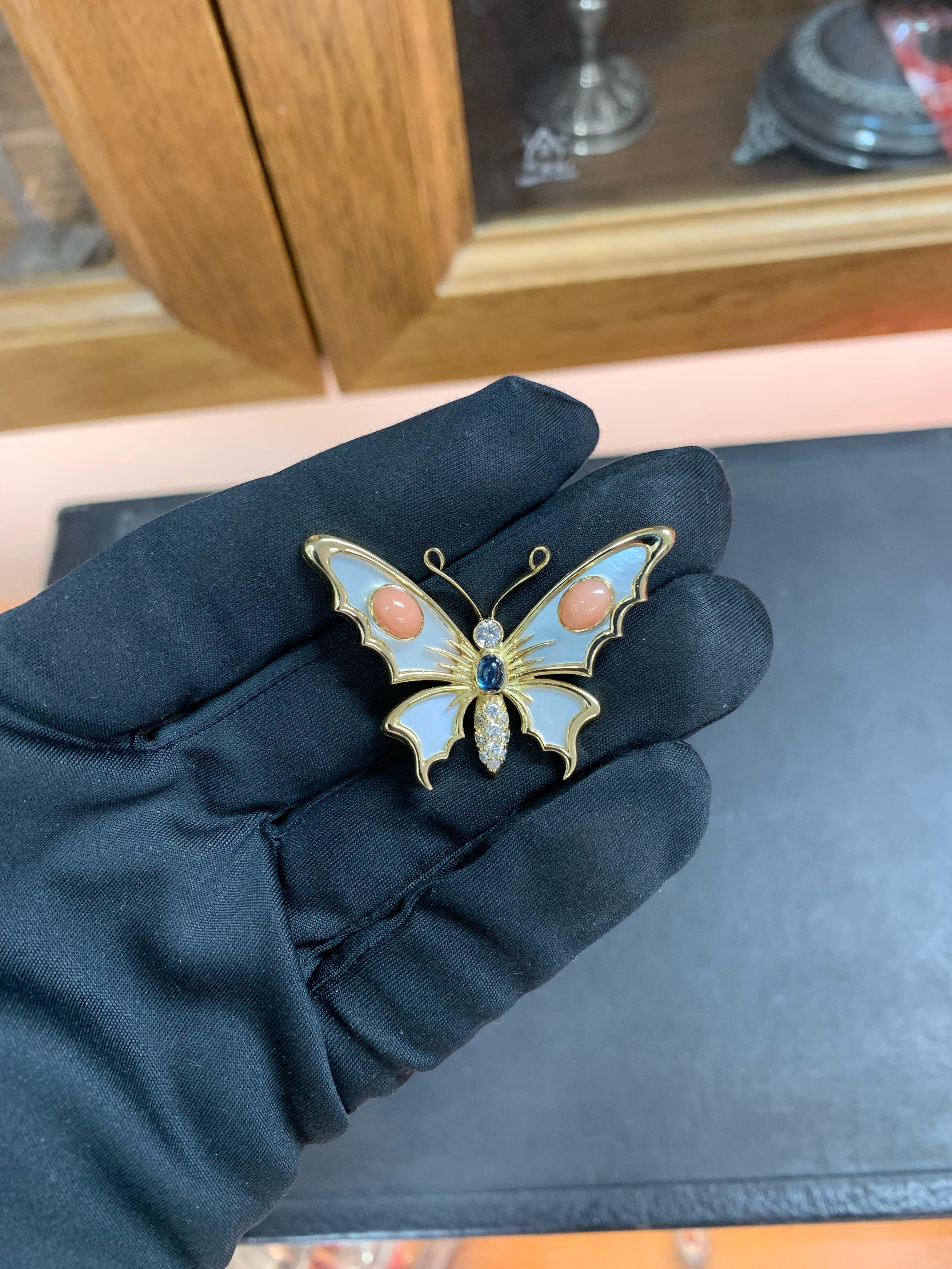 Beautifully Hand Crafted 18k Yellow Gold Butterfly Pendant Set With Mother Of Pearl, Corals, Blue Sapphire & Diamonds.
Amazing Shine, Incredible Craftsmanship.
Great Statement Piece.
Nice & Large Size Pendant.
