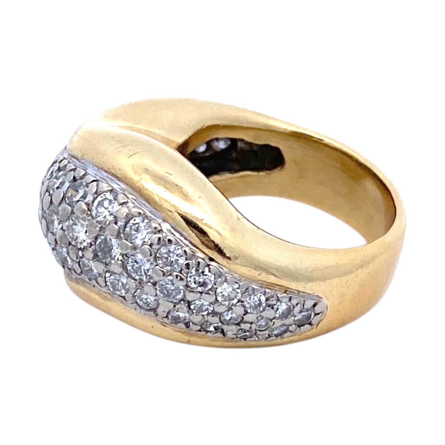 Late 20th Century dome ring crafted in 18k yellow and white gold. The design features a sweeping, contoured band adorned with brilliant-cut white diamonds. The diamonds are set in a pave style, creating a shimmering surface.
Diamonds 2.5 carats.