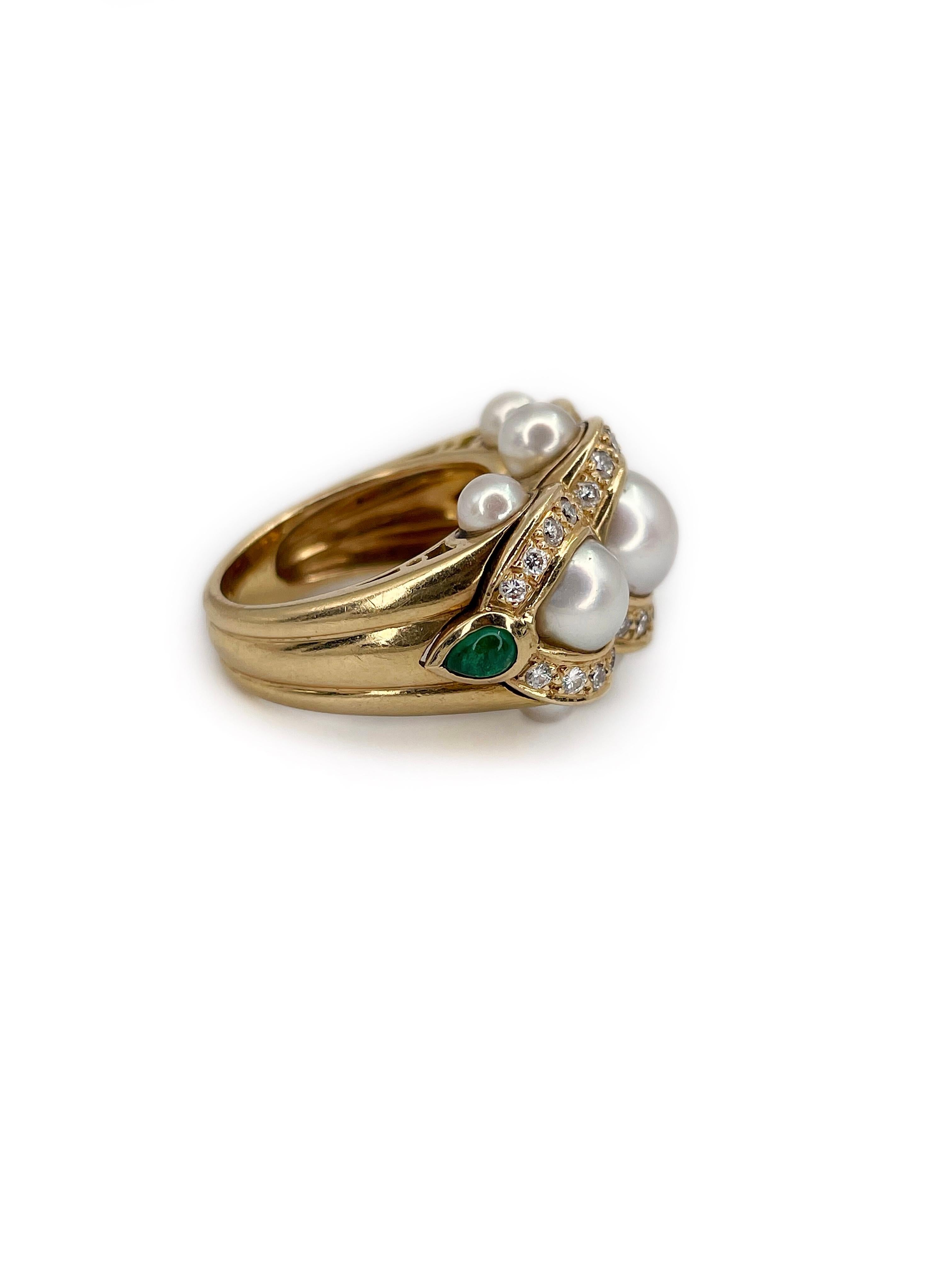 This is an unusual design three stone cocktail ring crafted in 18K yellow gold. The piece features:
- pearls: 3 large and 6 smaller, cultured
- diamonds: 30pcs., brilliant cut, 0.45ct, RW-W, VS
- emeralds: 2pcs., pear shape, cabochon cut, 0.34ct,