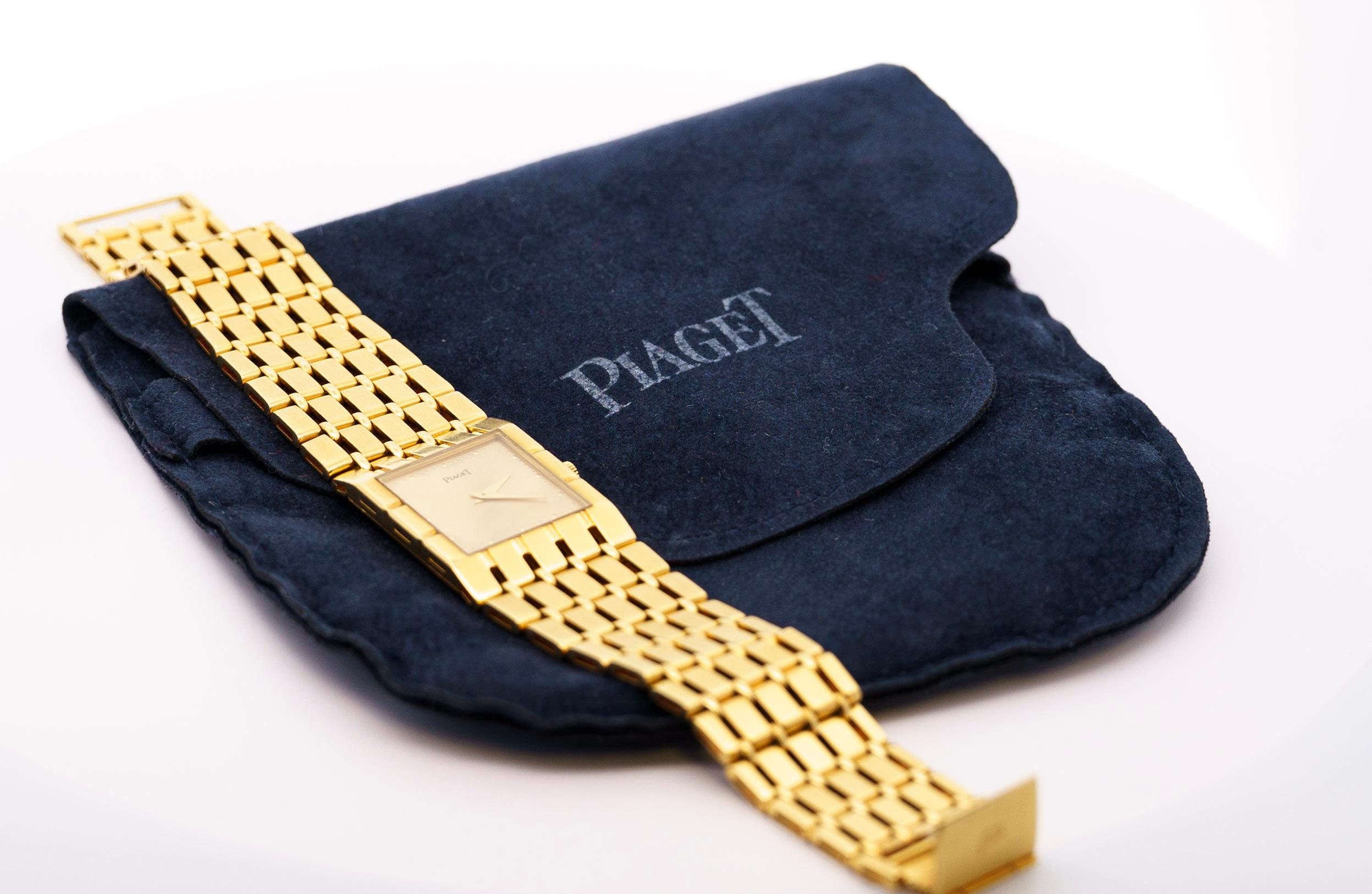Vintage Piaget Polo 18k yellow gold unisex wristwatch, reference 9131 K51, with automatic movement, a gold face, dotted border, and a five-row link bracelet. Maker's mark and hallmark on the case back, marked 750, and a maker's mark on the fold-over