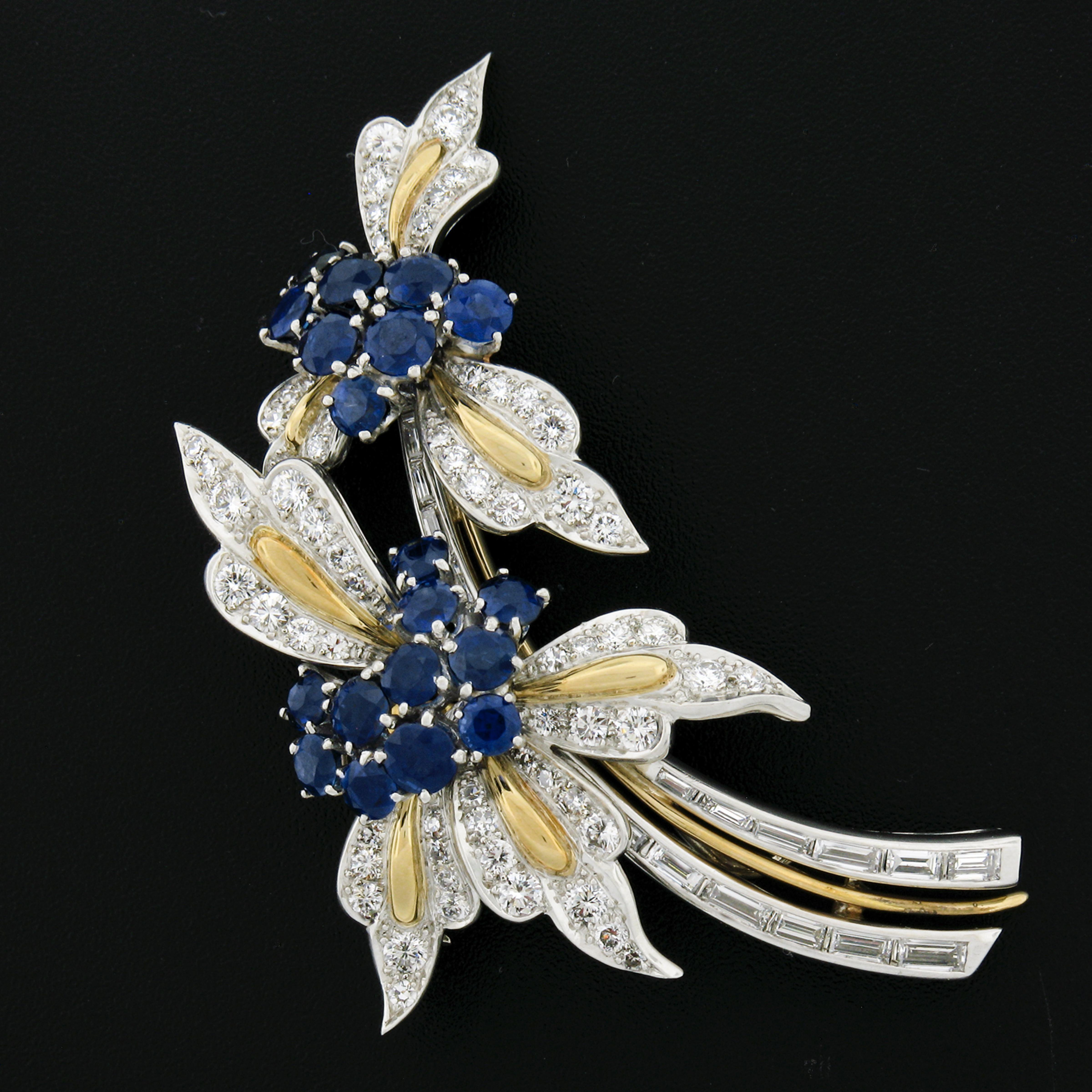Here we have an absolutely jaw dropping vintage brooch that was very well crafted from solid platinum and 18k yellow gold. This fancy brooch features a beautiful dual flower and branch design that is completely drenched with TOP QUALITY sapphires