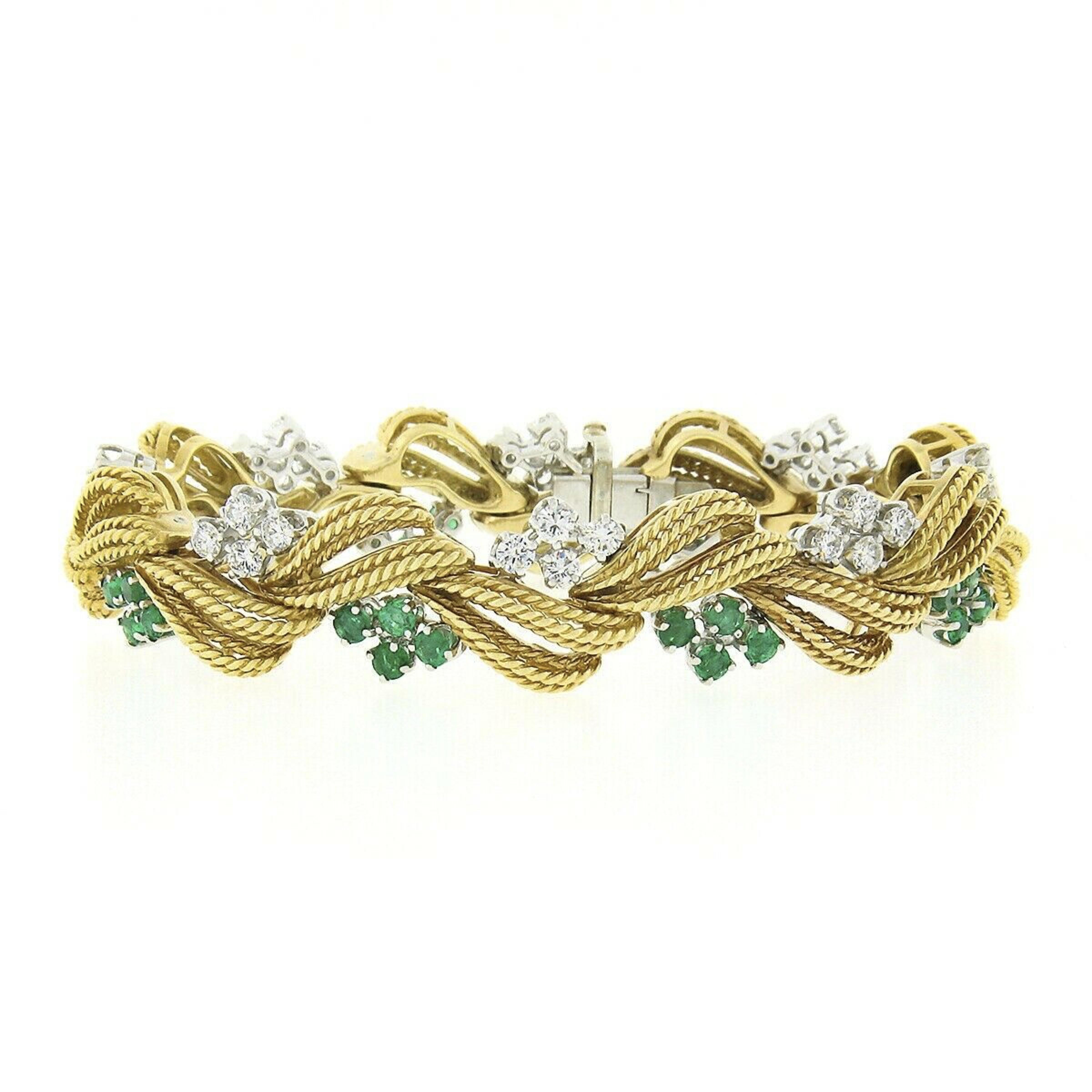 This magnificent vintage statement bracelet was very well crafted from solid 18k yellow gold and platinum and features top quality emeralds and diamonds neatly prong set in clusters throughout. Its absolutely elegant design is constructed from