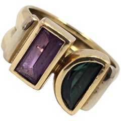 Anello bypass con zaffiro viola e tormalina verde in oro 18 carati vintage