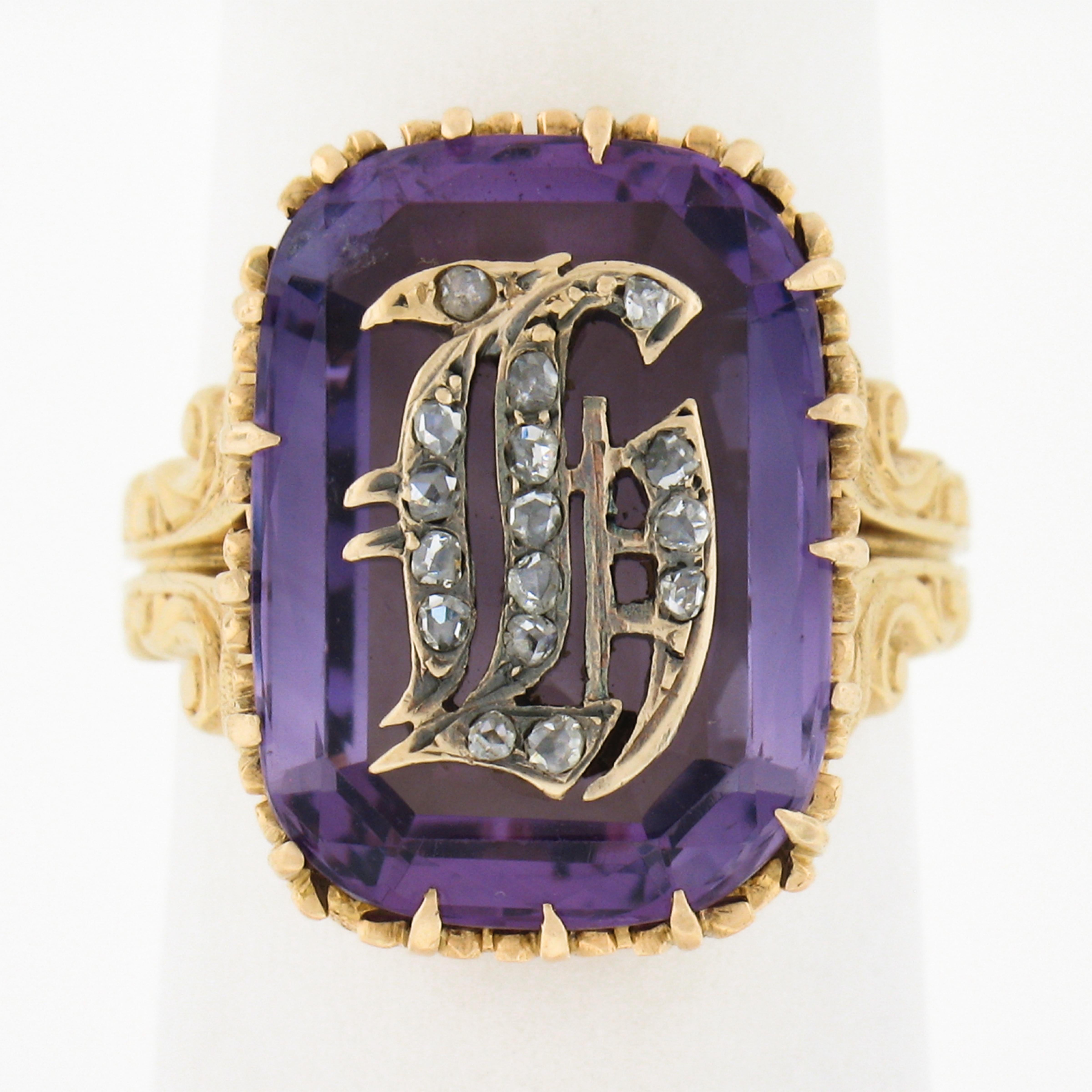 This fancy vintage initial cocktail ring is crafted in  solid 18k yellow gold and features a very fine quality amethyst stone at its center and decorated with fancy prongs and magnificent detailed repousse work throughout the shoulders and the