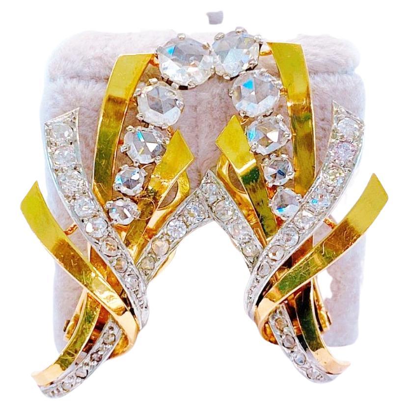 Vintage large earring in 2 tone gold colour in floral designe topped with 10 large rose cut diamonds and smaller diamonds estimate weight of 2.5 carats un foiled back while colour excellent spark earrings was made between 1950/1960 with back clips