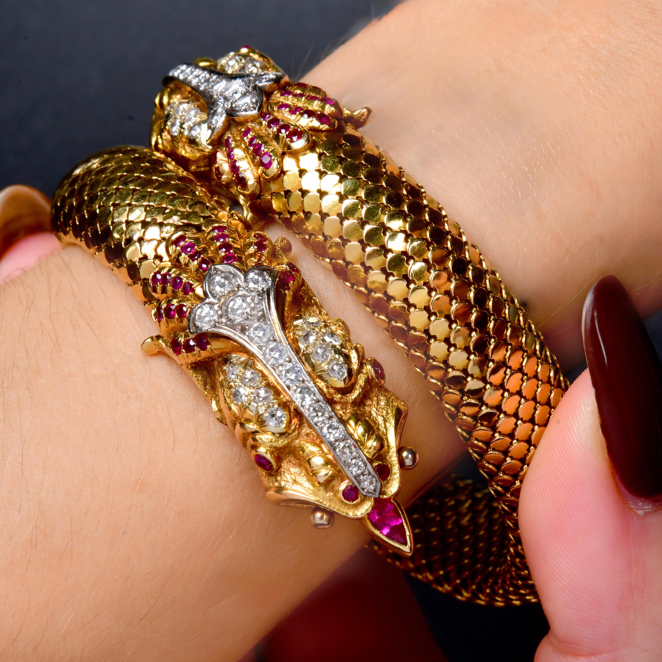 A bold vintage wrap dragon bracelet crafted in 18K yellow gold with an intricate dragon motif. The design features detailed scale texture along the coiled body and sculpted dragon heads at each end. Diamonds accent the head and crest, while