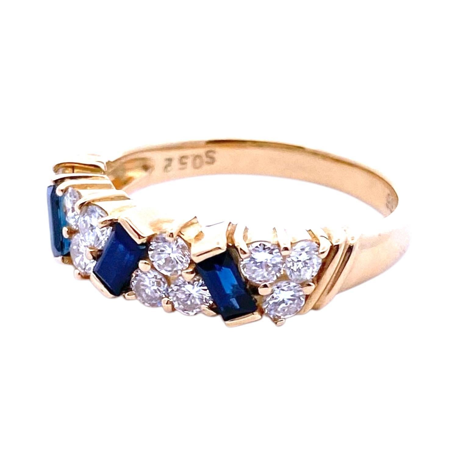 Crafted in 18k yellow gold ring, featuring three scattered blue baguette-cut sapphires alternating with three-stone diamond clusters.
3 sapphire: 0.52 ctw.
12 round brilliant cut diamonds: 0.66 ctw, SI1-SI2 clarity, G-H color