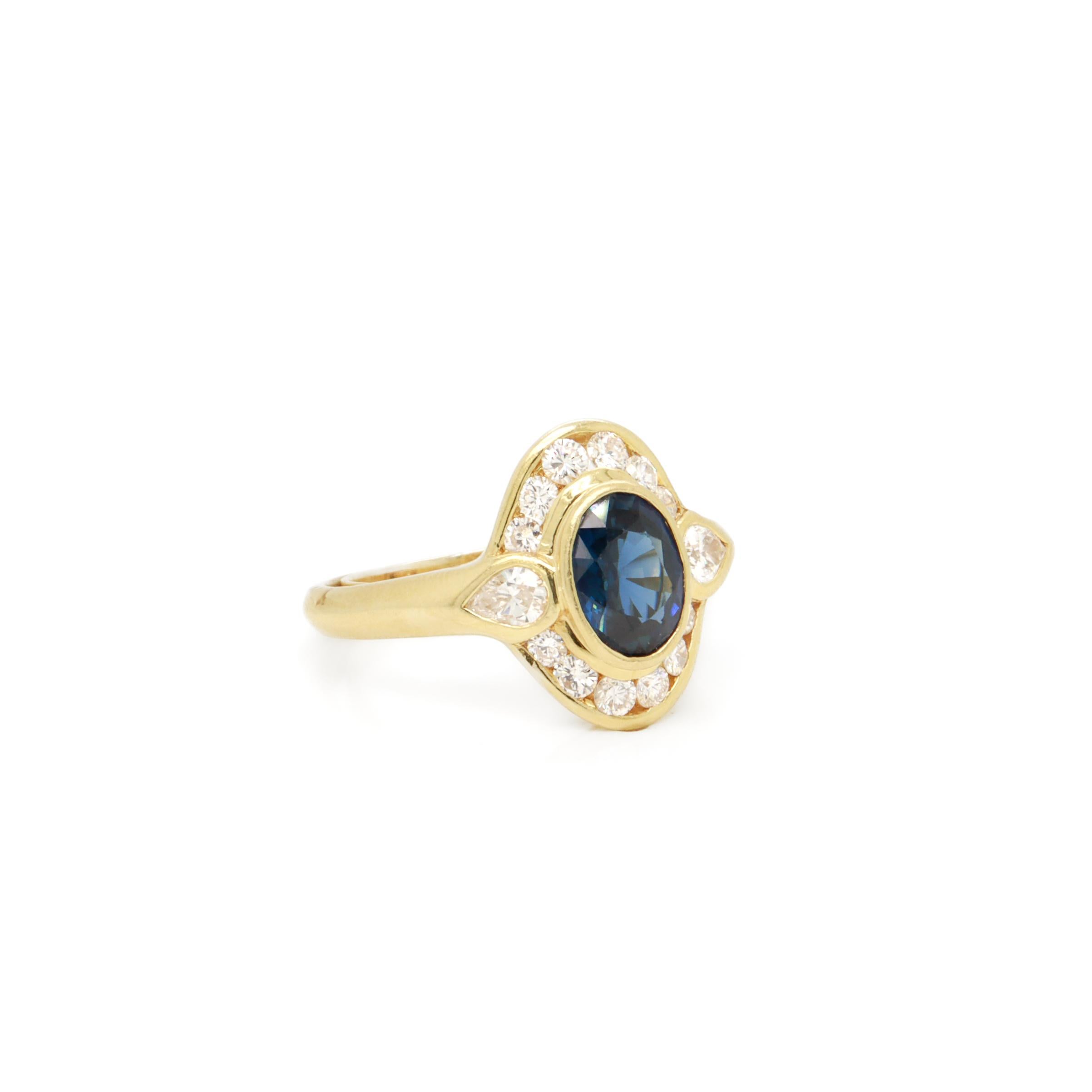 A fine vintage gold, sapphire, and diamond ring

In 14 karat yellow gold.

With a central bezel-set 1.50ct± oval mixed cut natural sapphire surrounded by 2 pear cut diamonds and 12 round brilliant cut diamonds.

With resizing clutch to the
