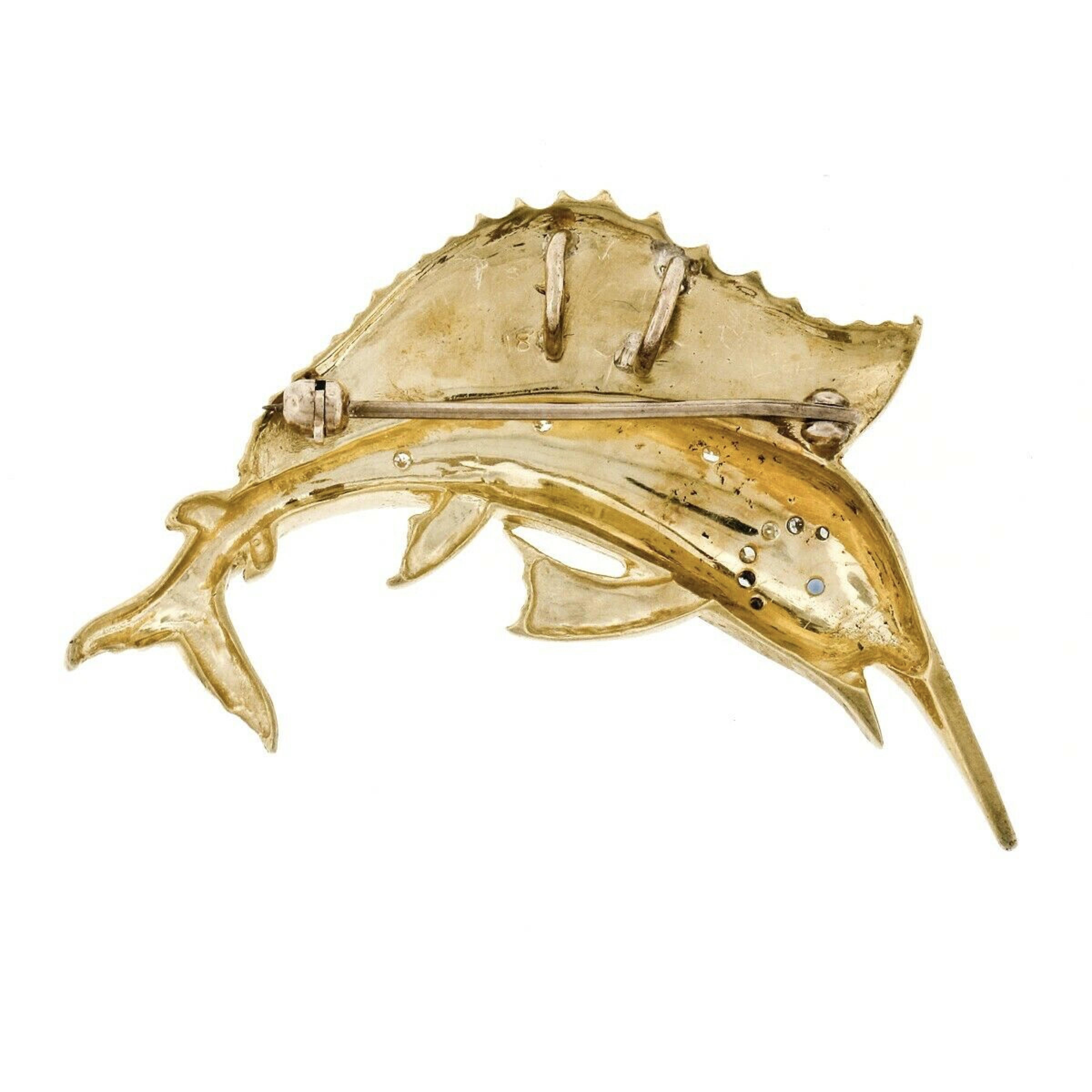 This wonderful vintage brooch/pin or pendant is crafted in solid 18k yellow gold and features perfectly structured sailfish design with unique, remarkably outstanding workmanship and texture that bring out maximum detailing granting an exceptional