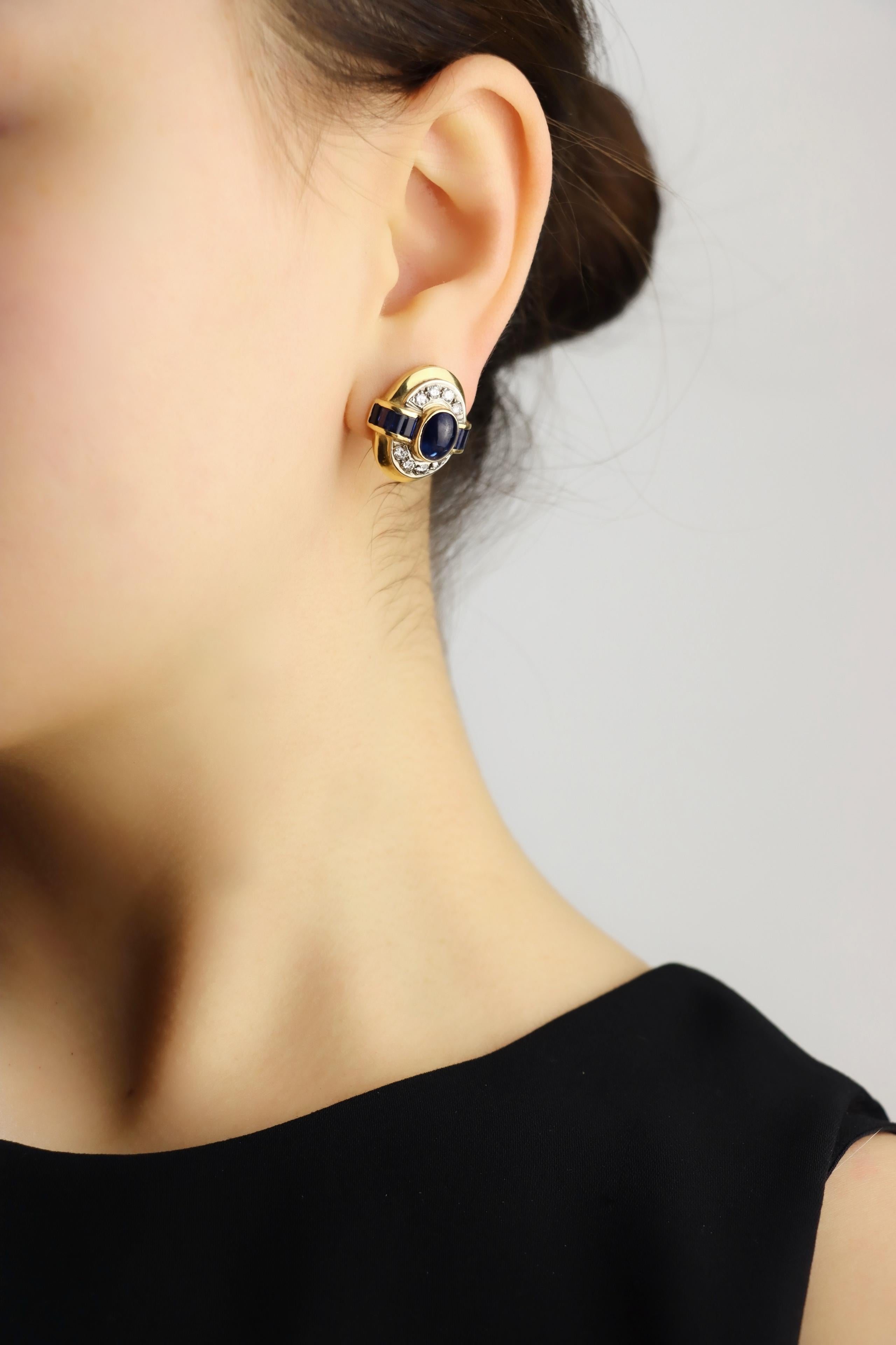 Vintage 18K Gold Sapphire Diamond Earring

Marked:
18K

Approximate Dimensions:
2 cm (Length) 
1.7 cm (Width)
Approx. 3 carats (Sapphire)
Approx. 0.8 carats (Diamond)
14.5 grams in weight.