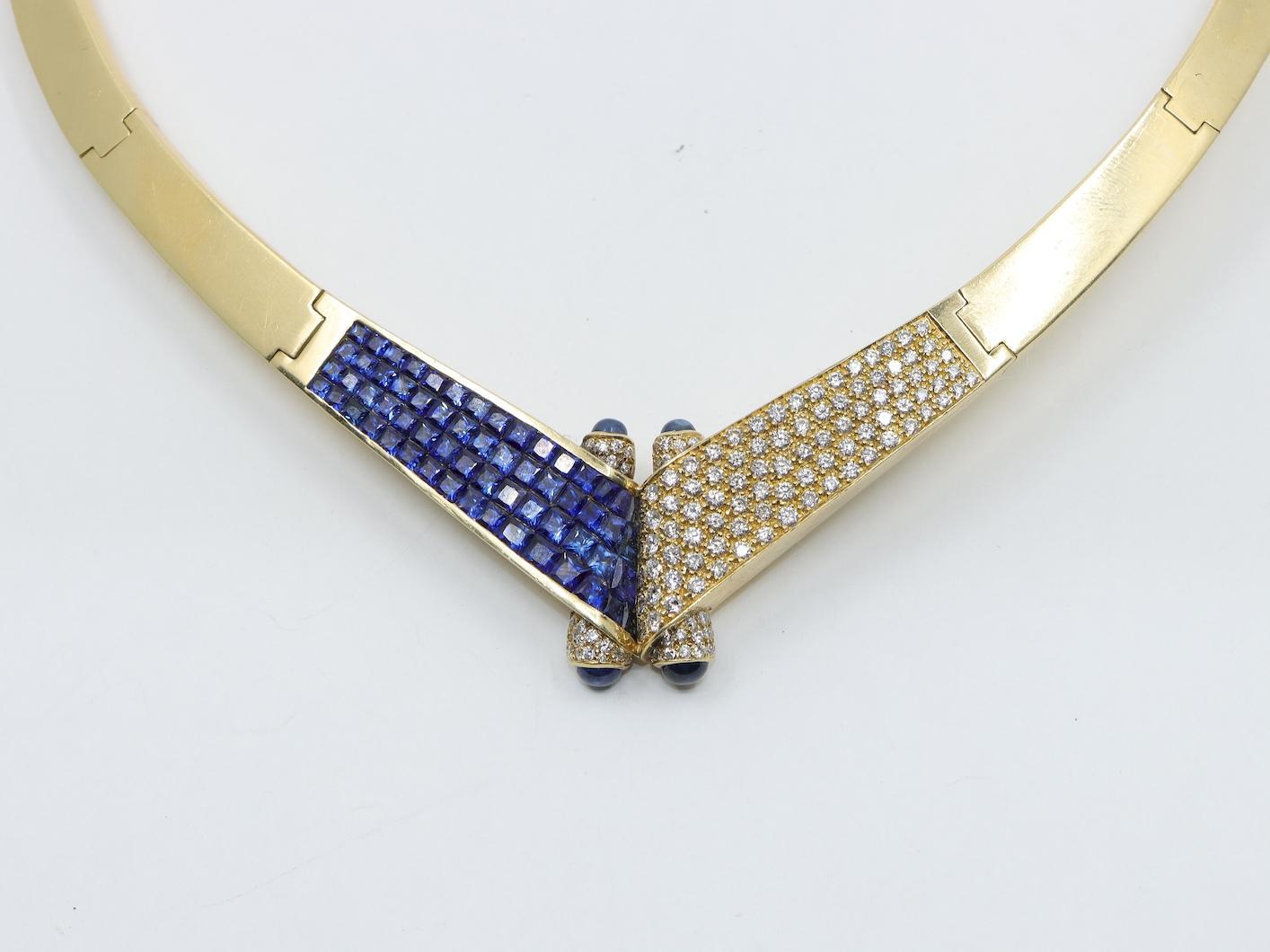 18K Gold Sapphire Diamond Torque Necklace 

Approximate Dimensions:
43 cm ( Length) 
2.5 cm - 0.5 (Width) 
Approx. 4.83 ct (Diamond) 
Approx. 7.5 ct (Sapphire) 
83.6 grams in weight.