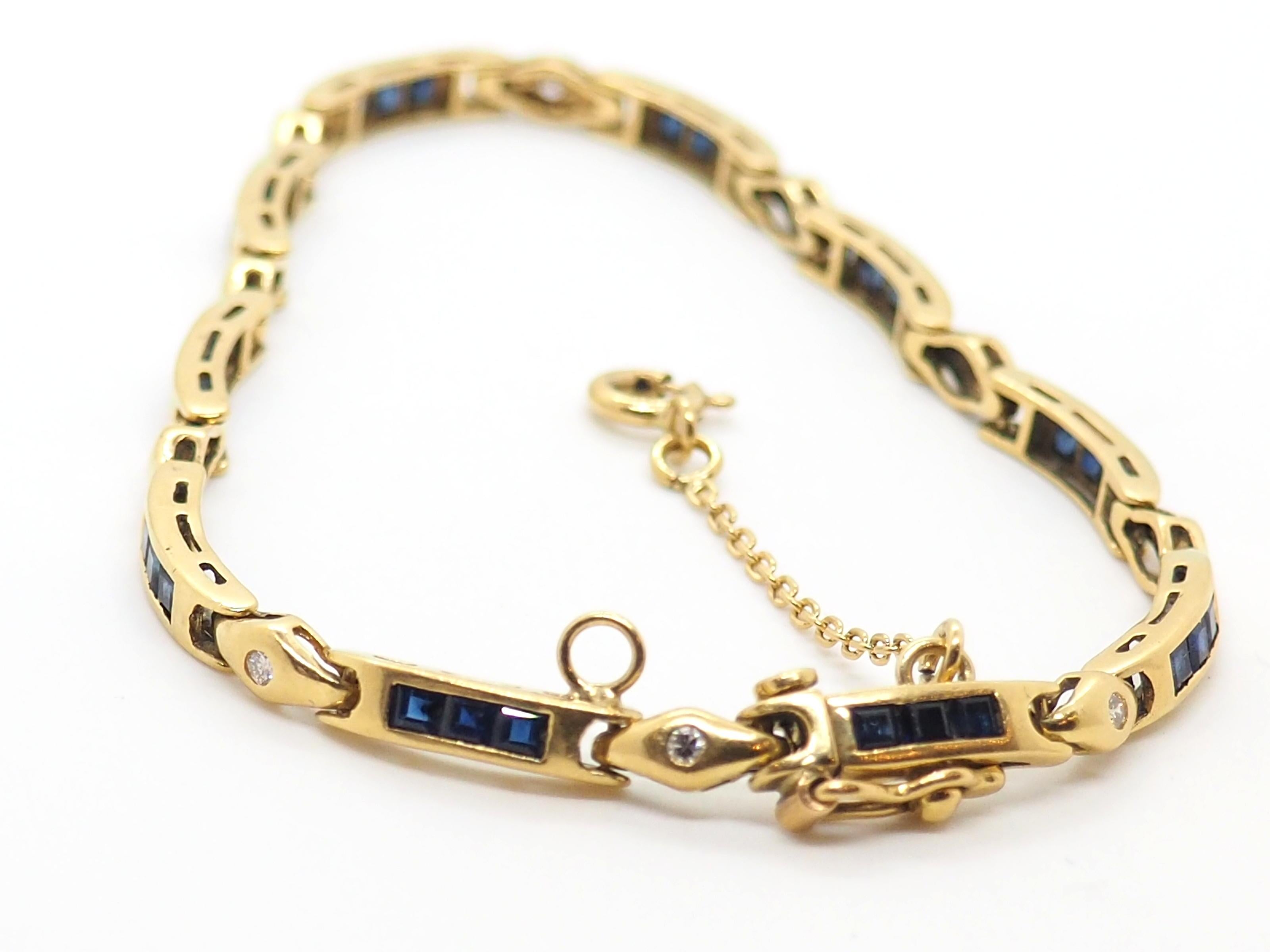 Vintage sapphire bracelet crafted in 18 Karat yellow gold.

Unveiling a Captivating Masterpiece: Exquisite Vintage 18k Yellow Gold Bracelet Adorned with 30 Square Sapphires and 10 Brilliant Round Diamonds 0.3 Carats. 

This bracelet is a testament