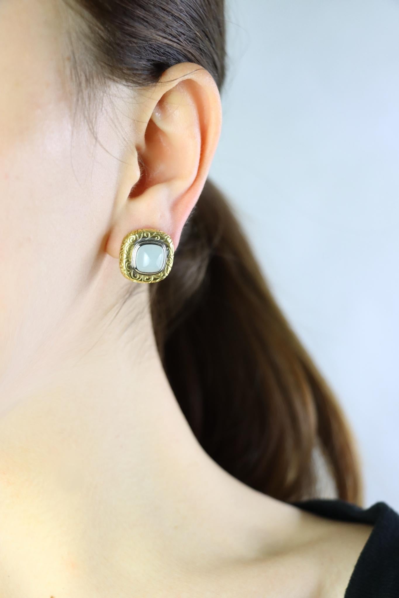 Vintage 18K Gold Square Jade Cabochon Earrings

Marked:
750

Approximate Dimensions:
1.7 cm (length) 
8.64 mm (width) x 5.32 (Depth) (Jade)
13.6 grams in weight.

** All dimensions listed above are approximations based on our measurements and