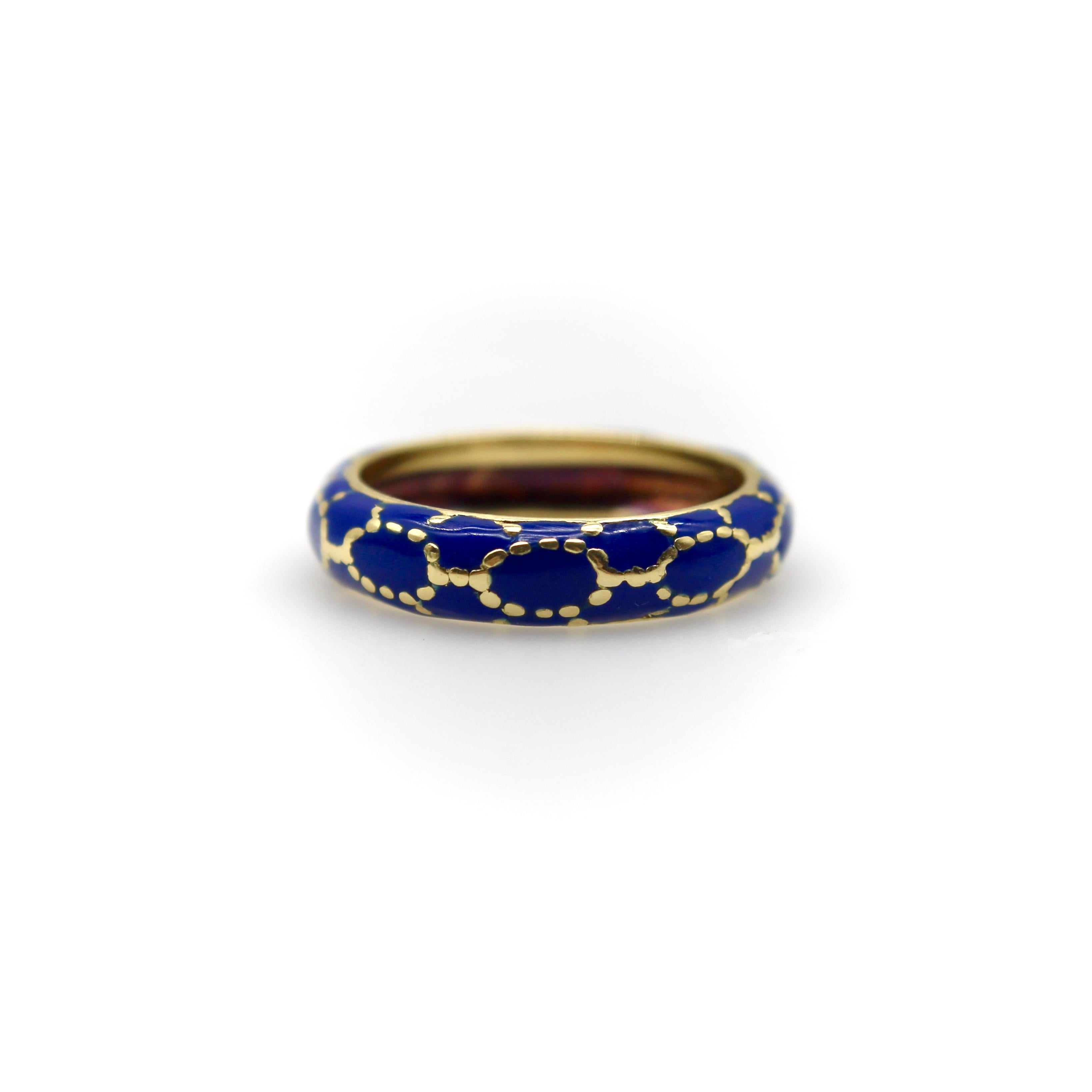 This vintage Tiffany & Co. ring features cobalt blue enamel executed in a precise lattice pattern. The vibrant enamel work contrasts elegantly with strategically placed gold dots, creating dimensional texture throughout the design. Crafted in 18k
