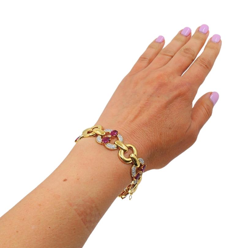  This Vintage Tourmaline Diamond Bracelet, masterfully crafted in 18k yellow gold. This striking piece features a bold, architectural link design, every other adorned with vibrant pink tourmalines and shimmering pavé-set diamonds. The tourmalines’