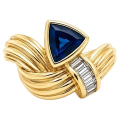 Vintage 18k Gold Trillion Sapphire w/ Baguette Diamond Ribbed Knot Band Ring