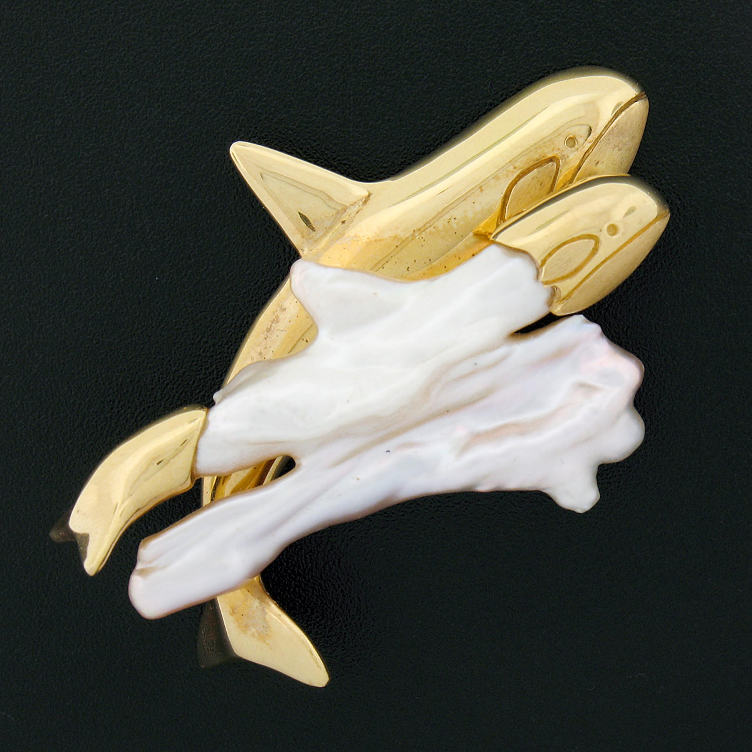 Here we have a custom made, vintage, brooch or pendant that was crafted from solid 18k yellow gold and a large, baroque, freshwater pearl in which has been turned into a beautiful orca whale design. The pearl's unique shape has been used perfectly