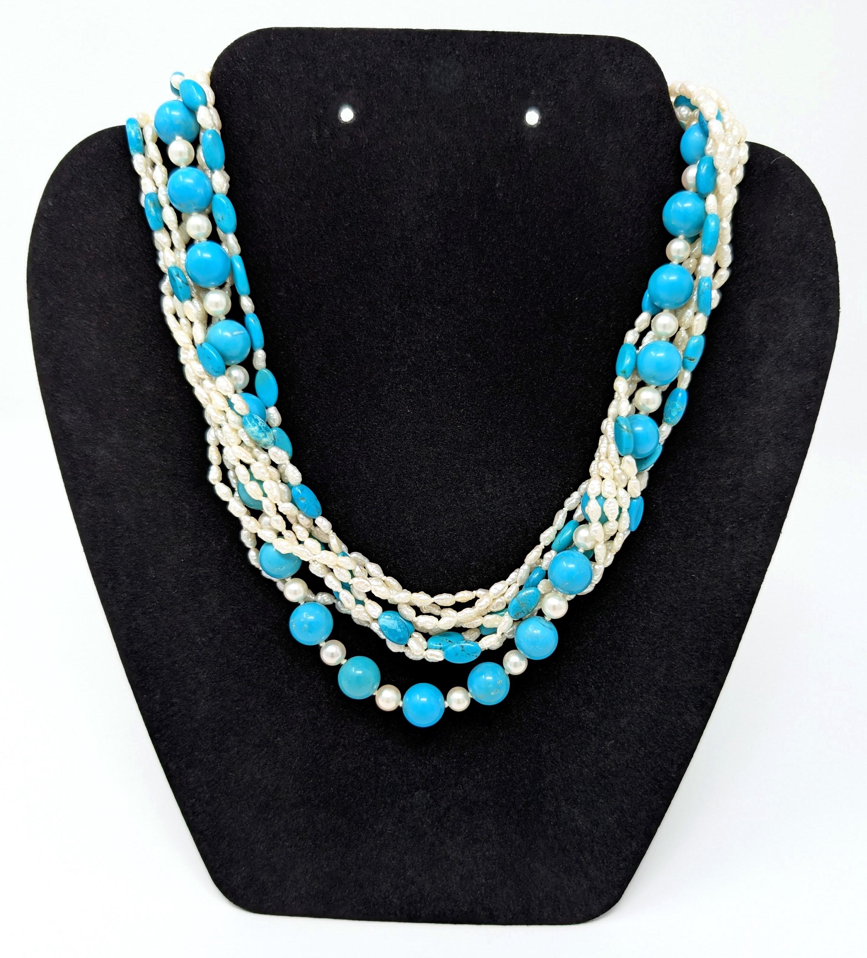 Striking vintage Italian torsade necklace, featuring multi strand turquoise and pearl beads. Hand knotted with a buttery gold 18k clasp. Stamped / hallmarked 750 along with a star 255 AL on the clasp (for the Italian jewelry designer). Measures