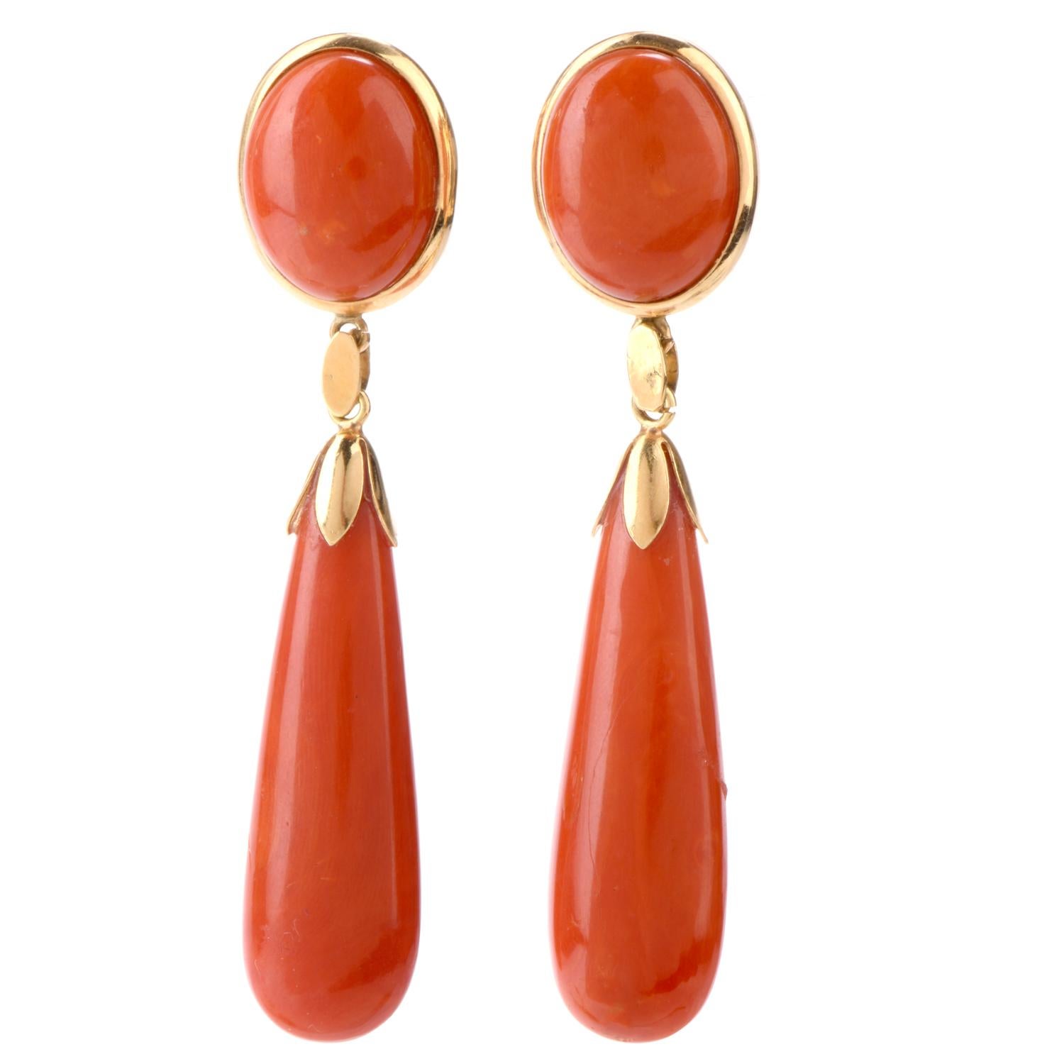 This Natural  Elegance comes in many different forms! This stunning  antique set features a button of Natural Red Coral against the ear and very elongated Teardrops dangling freely with floral caps of 18K yellow gold. 

Coral measures 13.06 x