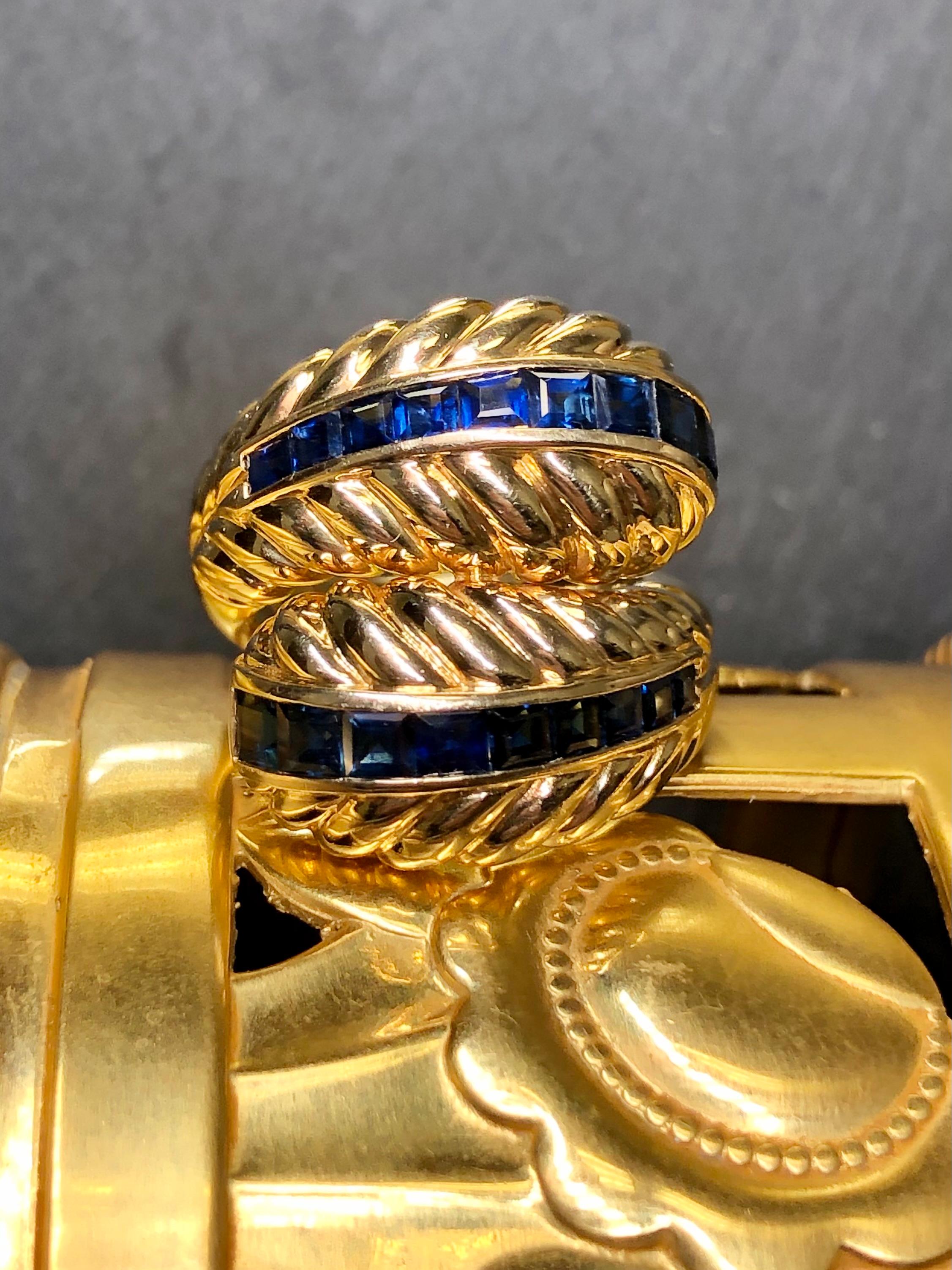 
A classic ring done by famed Italian designer SABBADINI. This timeless piece is hand crafted in 18K yellow gold in a scalloped design and channel set with approximately 3cttw in square cut natural sapphires.


Dimensions/Weight:

Ring measures 1”