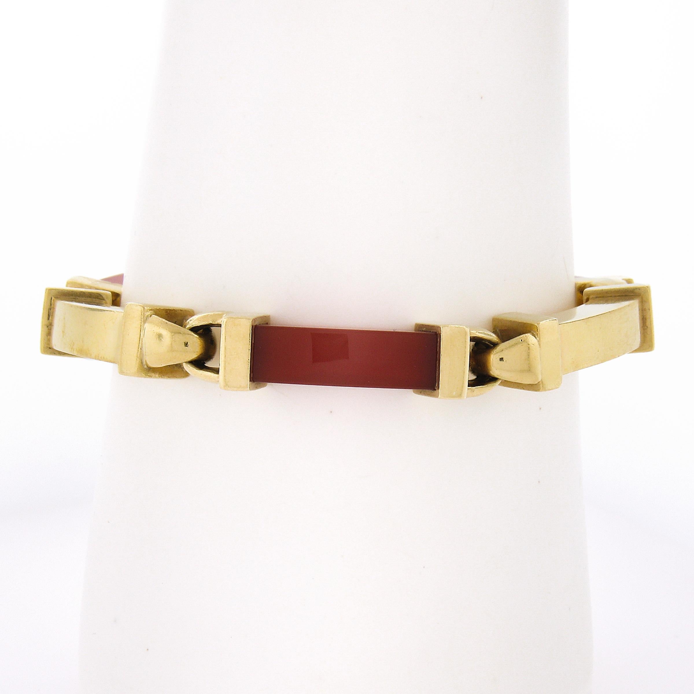 --Stone(s):--
(3) Natural Genuine Carnelians - Curved Rectangular Shape - Cap Set - Nice Orangy Brown Color

Material: Solid 18k Yellow Gold
Weight: 50.39 Grams
Chain Type:	Alternating Carnelian & Gold Links
Chain Length:	Comfortably fits up to 7