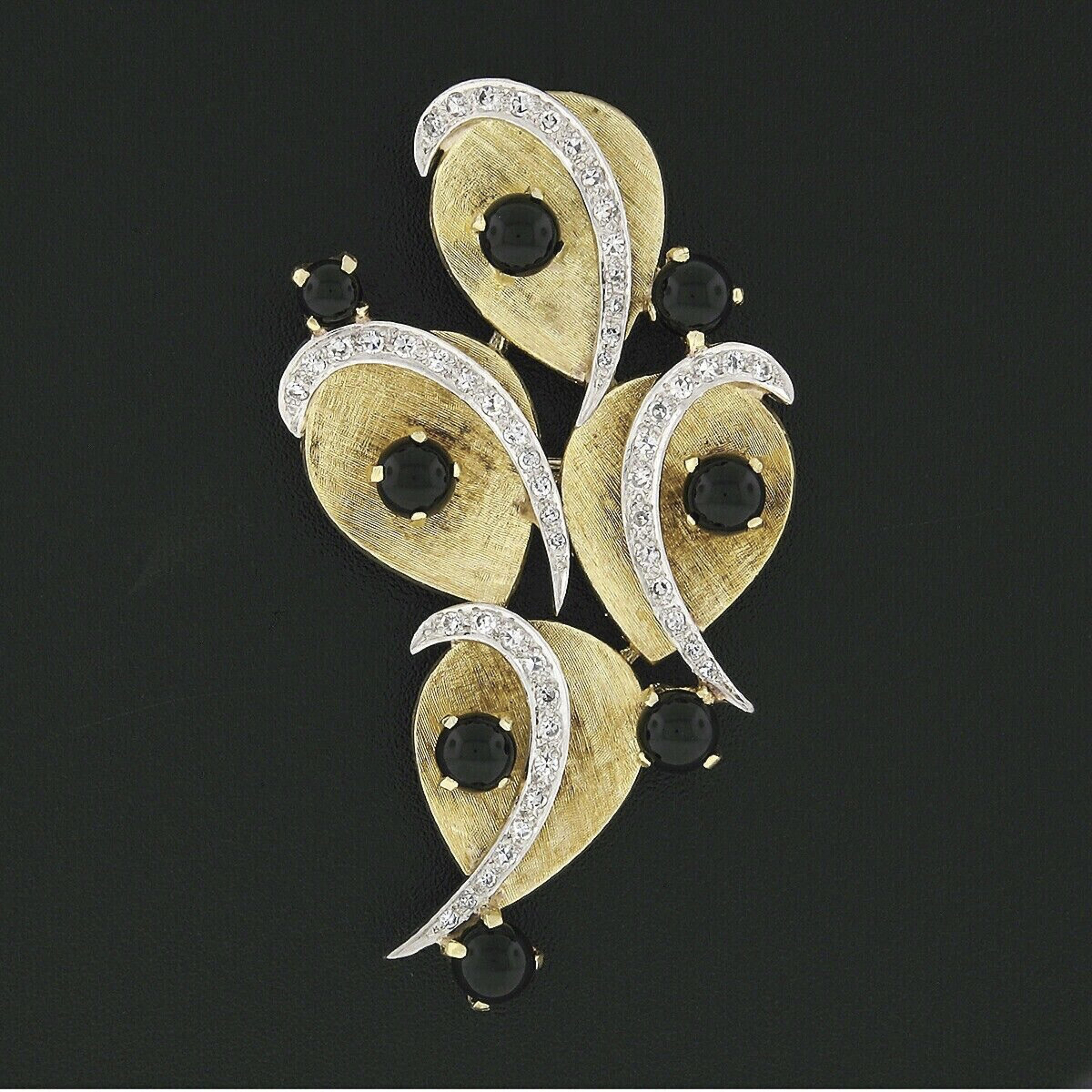 This absolutely magnificent vintage brooch or pendant was crafted from solid 18k yellow gold with white gold accents that are lined with fine diamonds throughout. The piece consists of four concave teardrop designs showing a beautiful Florentine