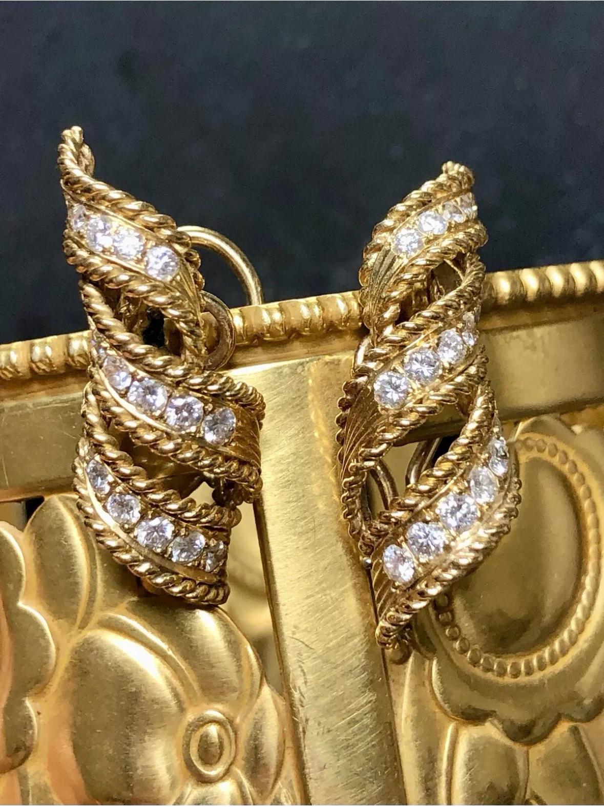 An elegant pair of Huggie earrings c. the 1960’s hand done in 18K yellow gold and set with approximately 1.70cttw in G-H color Vs2-Si2 in clarity. Earrings have omega backs.


Dimensions/Weight:

Earrings measure 1.20” by .45” and weigh