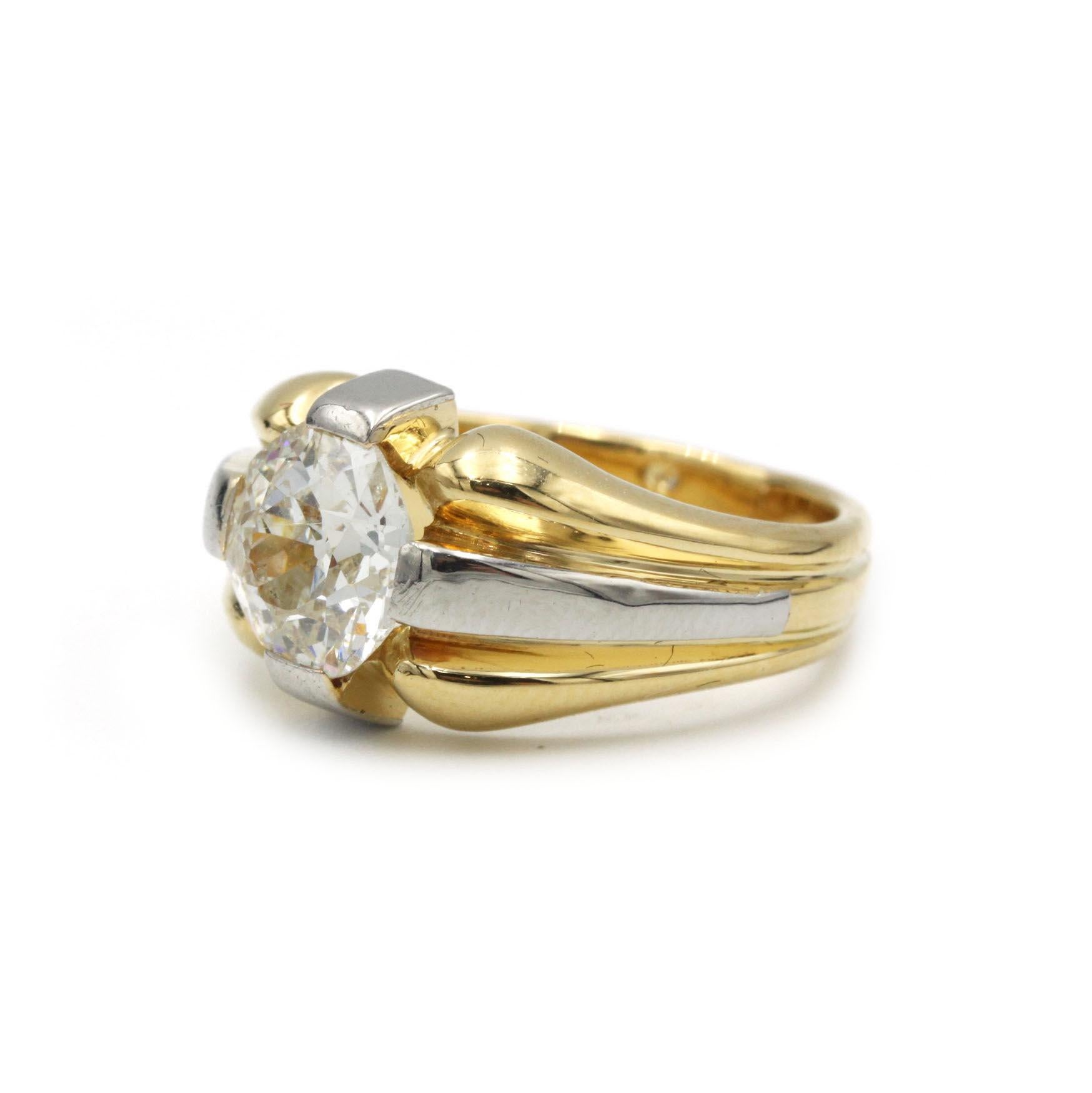 Discover an extraordinary blend of antique charm and modern craftsmanship in this vintage signet ring. Meticulously fashioned from 18K (750‰) yellow and white gold, the centerpiece is a rare 2.00 carat Old European–cut diamond, graded H/I color,