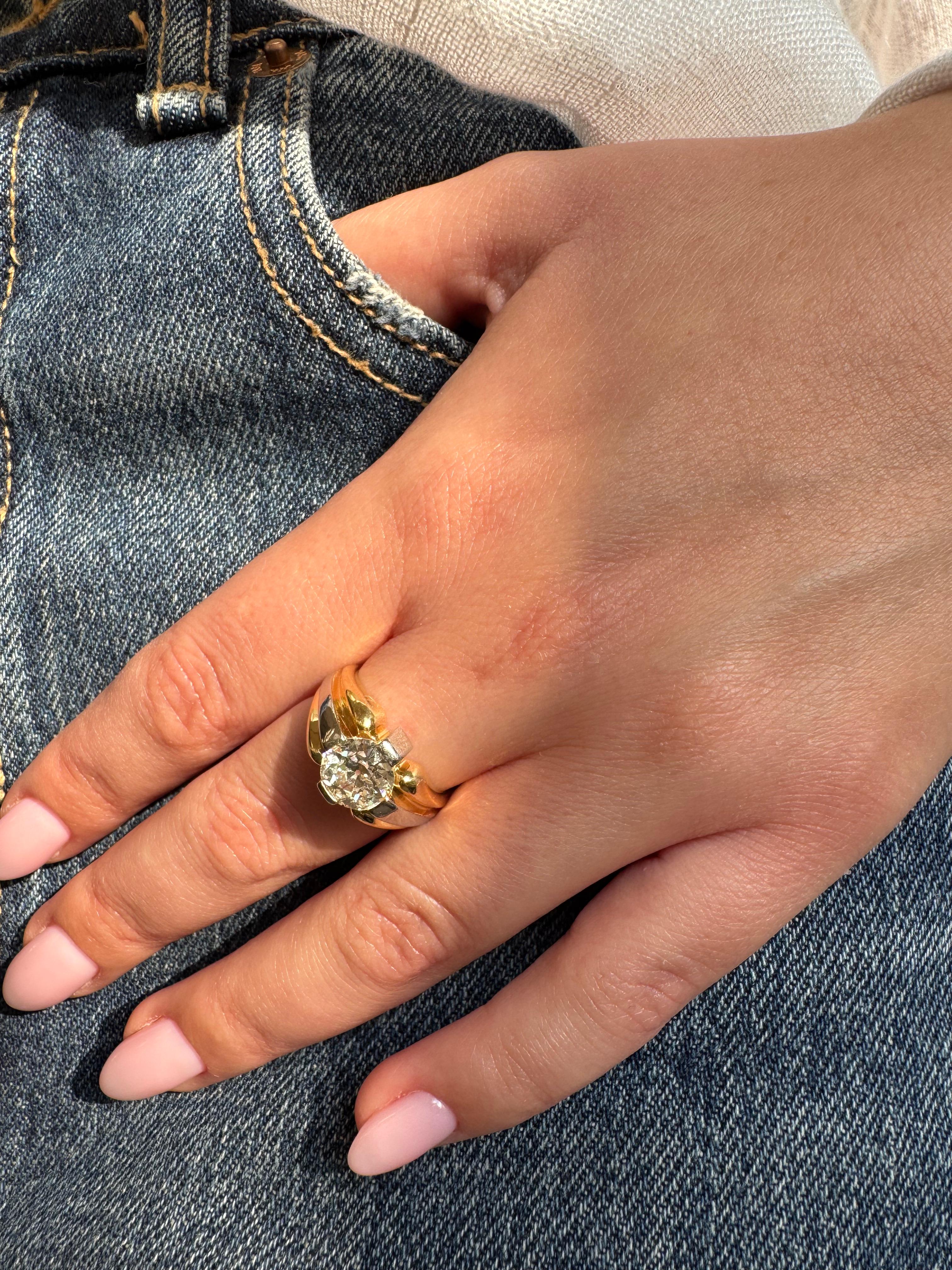 Discover an extraordinary blend of antique charm and modern craftsmanship in this vintage signet ring. Meticulously fashioned from 18K (750‰) yellow and white gold, the centerpiece is a rare 2.00 carat Old European–cut diamond, graded H/I color,