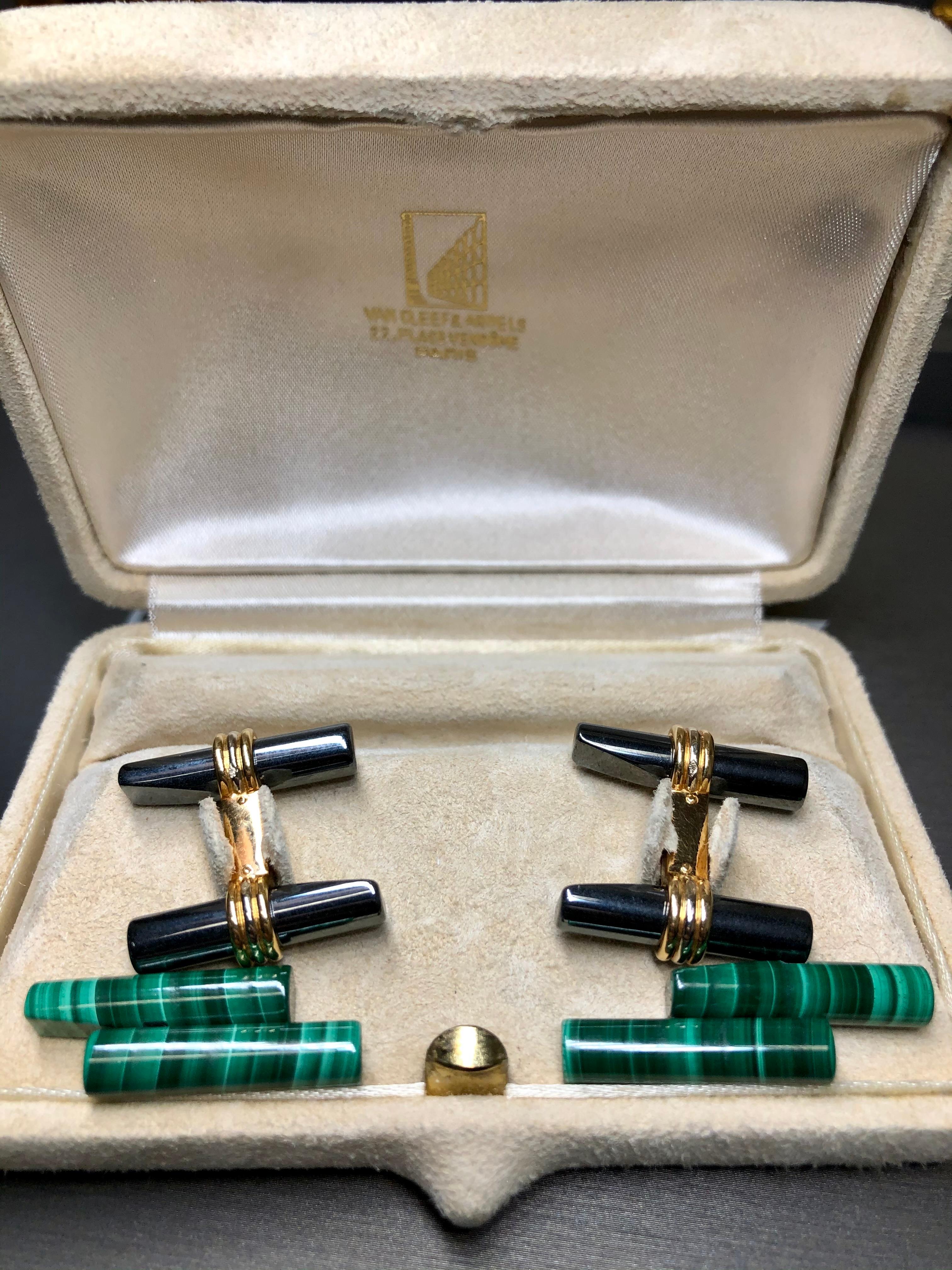 An original pair of cufflinks by VAN CLEEF & ARPELS with changeable hematite and malachite sections. Cufflinks are accompanied by original box and Amex receipt attributing original ownership to someone in the Breitling family. Originally purchased