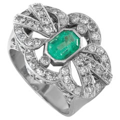 Bague vintage en or blanc 18 carats, sertie d'un diamant de 0,84 ct et d'une émeraude – MF04-063026