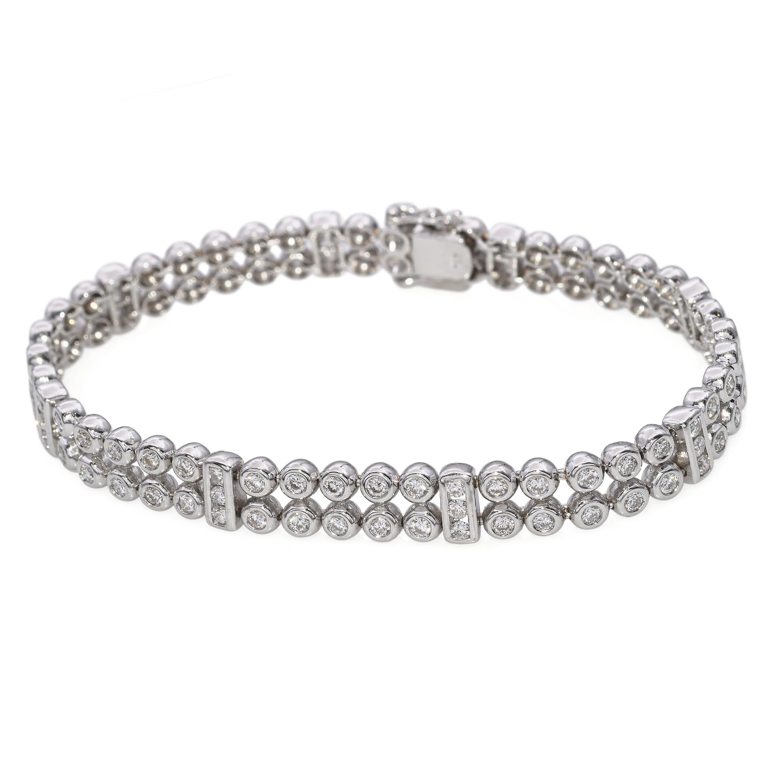 Vintage 18k White Gold 1.32tcw Diamond Tennis Bracelet. This elegant bracelet features a continuous line of sparkling round brilliant cut diamonds totaling approximately 1.32 carats. Each diamond is set in a secure 18k white gold four-prong mount,