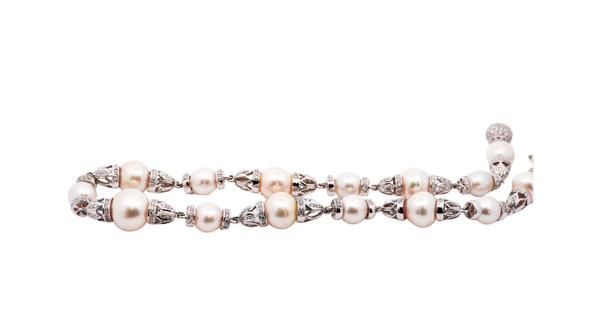 Cultured South Sea Pearls and Diamond Necklace in 18k white gold. Featuring a diamond-encrusted box closure and cone shaped links that connect the pearls. The pearls bear moderate blemishes, excellent luster, and good uniformity. This is a piece