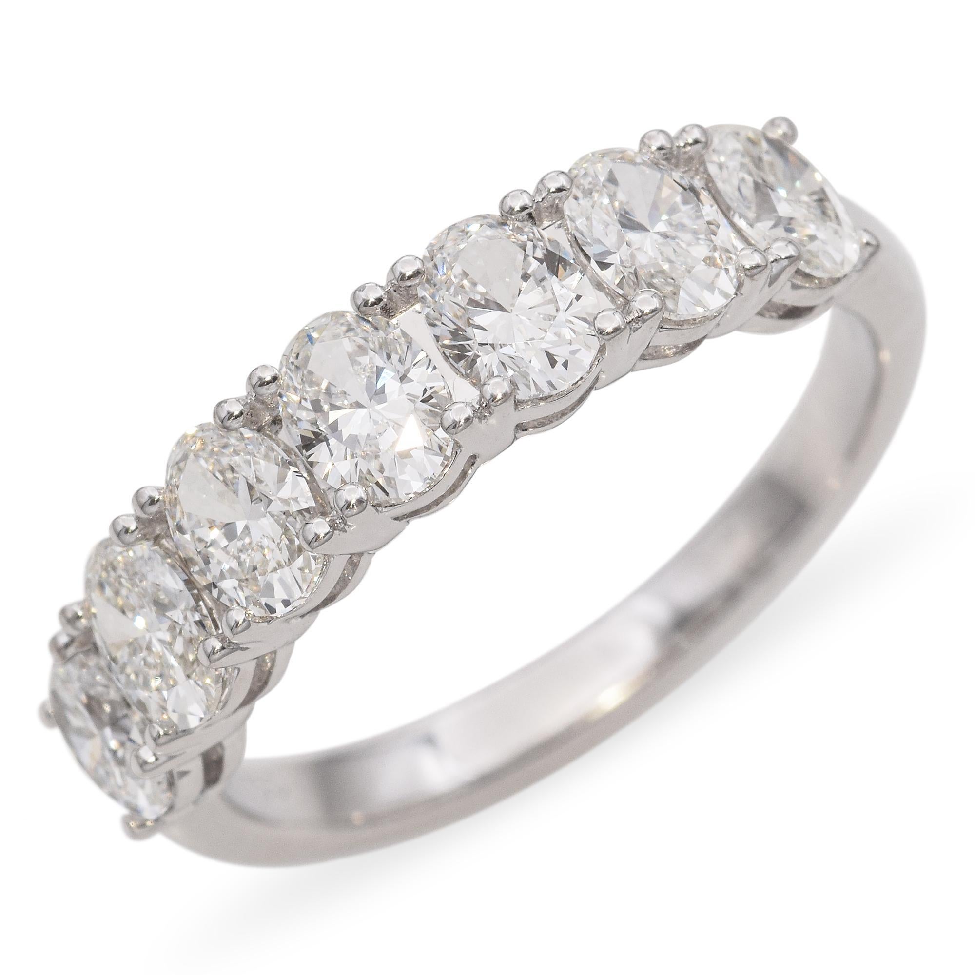 This vintage 18k white gold ring showcases a 1.54tcw oval diamond cluster that gracefully follows the curve of the band. The sleek, low-profile design offers both sparkle and sophistication, with each diamond set to enhance the ring’s fluid