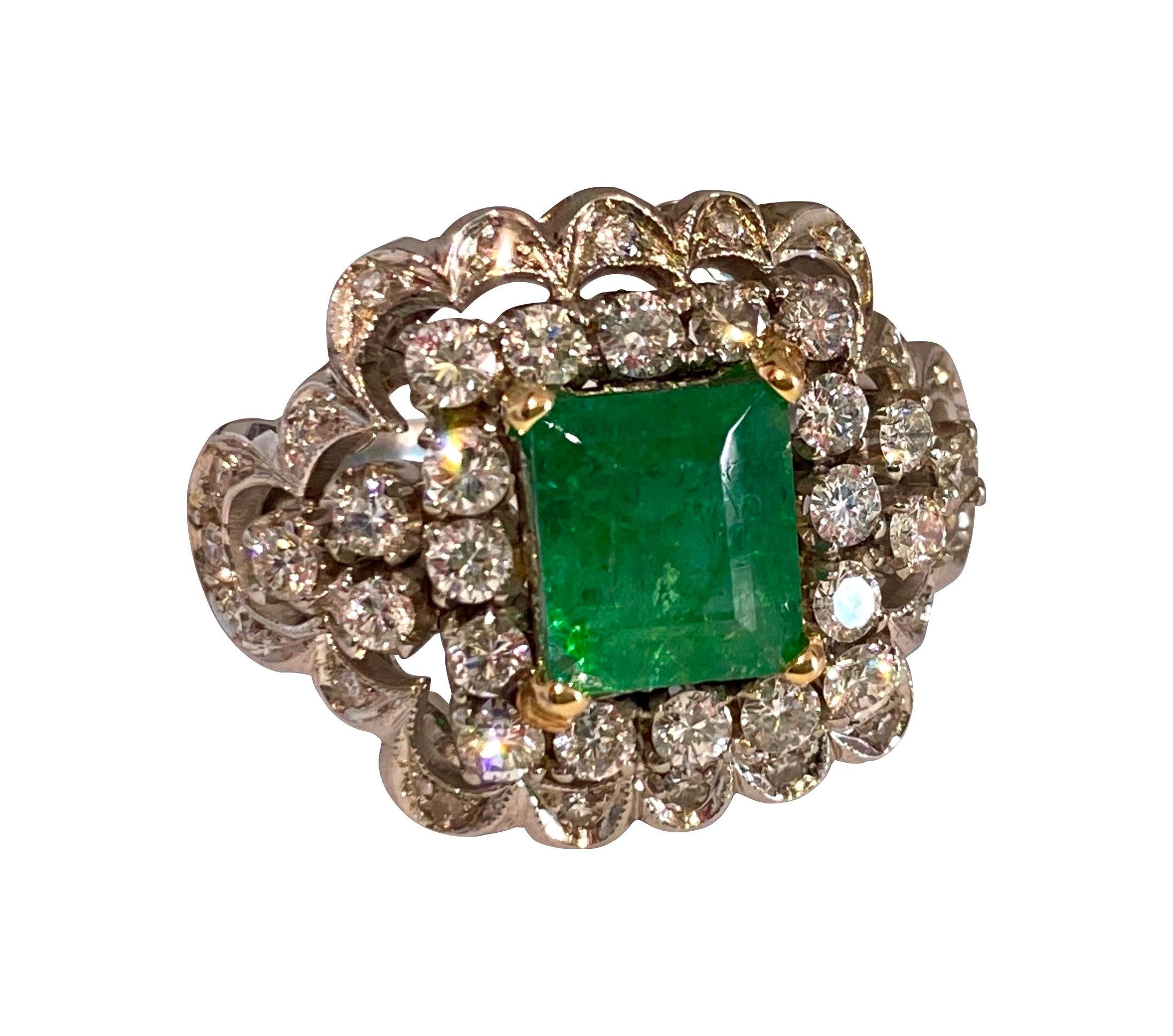 Exquisite vintage ring crafted from 18k white gold, featuring a total of 5.05 carats of natural earth mined diamonds and emeralds, boasting superb luster and deep saturation. With 2.05 carats of VS clarity, F color diamonds and 3.00 carats of richly