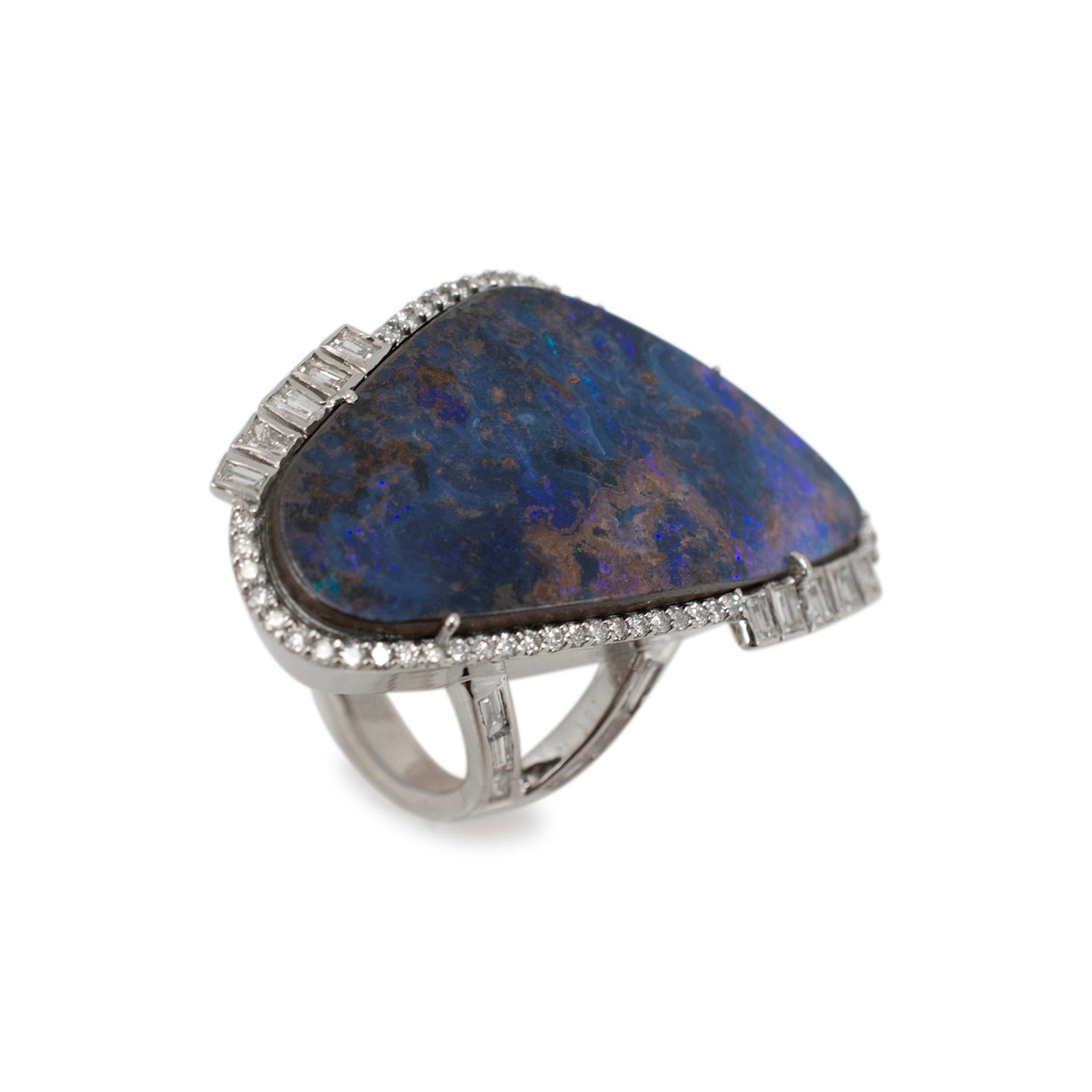 Gender: Ladies

Metal Type: 18K White Gold

Ring Size: 7.5

Weight: 16.82 grams

One ladies 18K white gold diamond and opal vintage halo cocktail ring with a half-round shank. The metal was tested and determined to be 18K white gold. In excellent