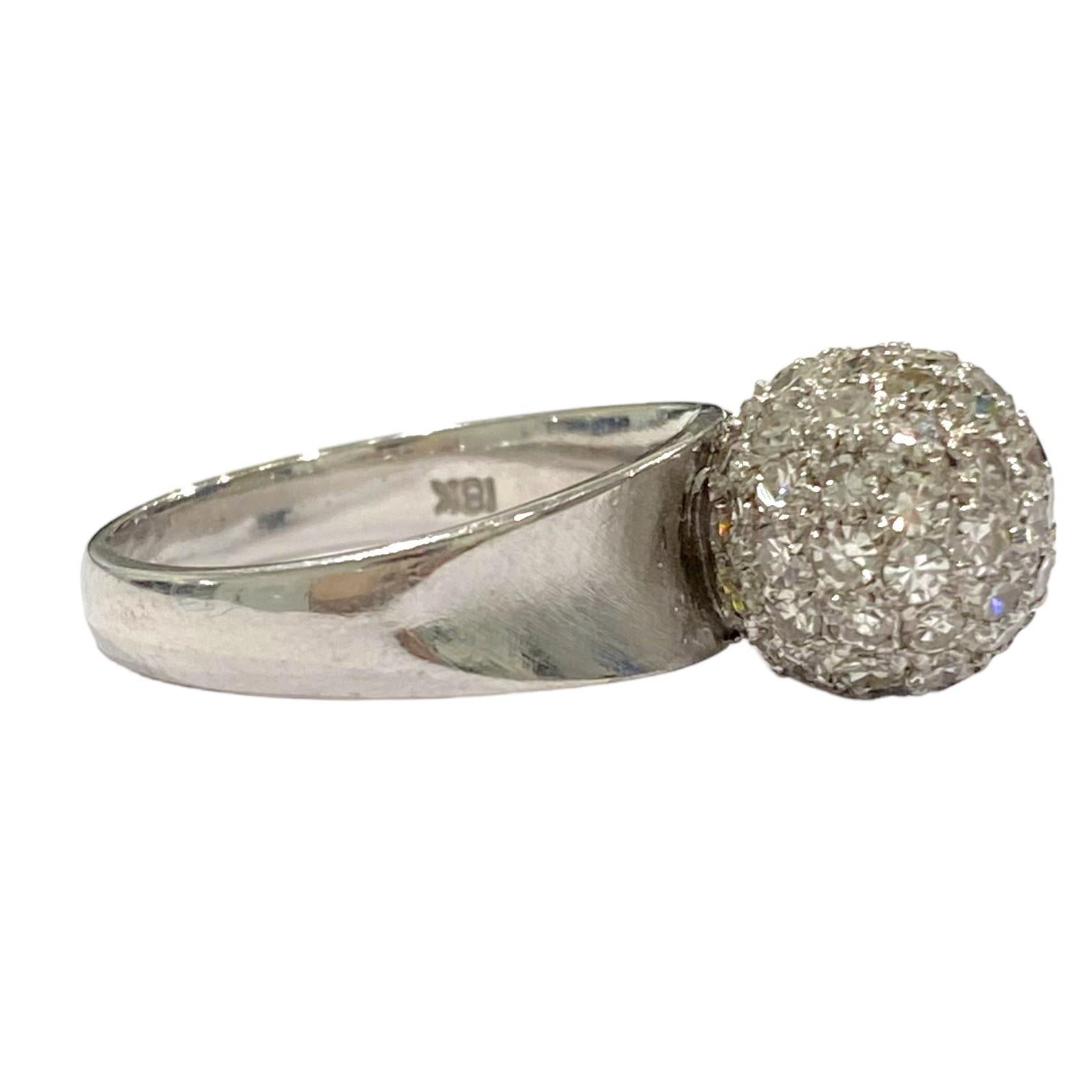 Crafted in 18K white gold, the ring features a diamond crusted ball on top set on a band with concave front. Bright polish and satin finish.
Diamonds: 1.00 ctw. Color: F-G, Clarity: VS1-VS2
Measurements:
Ball: 10.5mm in diameter
Band: 6.5mm (front)