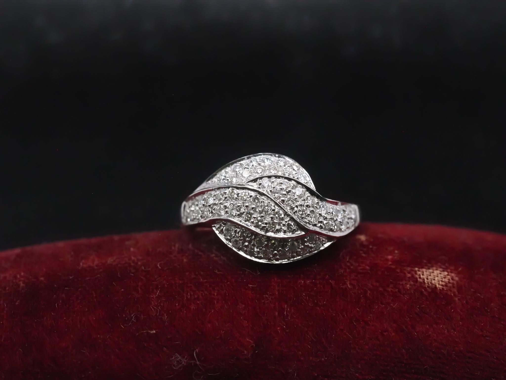 Year: 1980s

Item Details:
Ring Size: 7.75 (Sizable)
Metal Type: 18k white gold [Hallmarked, and Tested]
Weight: 7.1 grams

Diamond Details: .75ct total weight, G Color, VS Clarity, Round Brilliant

Band Width: 2.2mm
Condition: Excellent