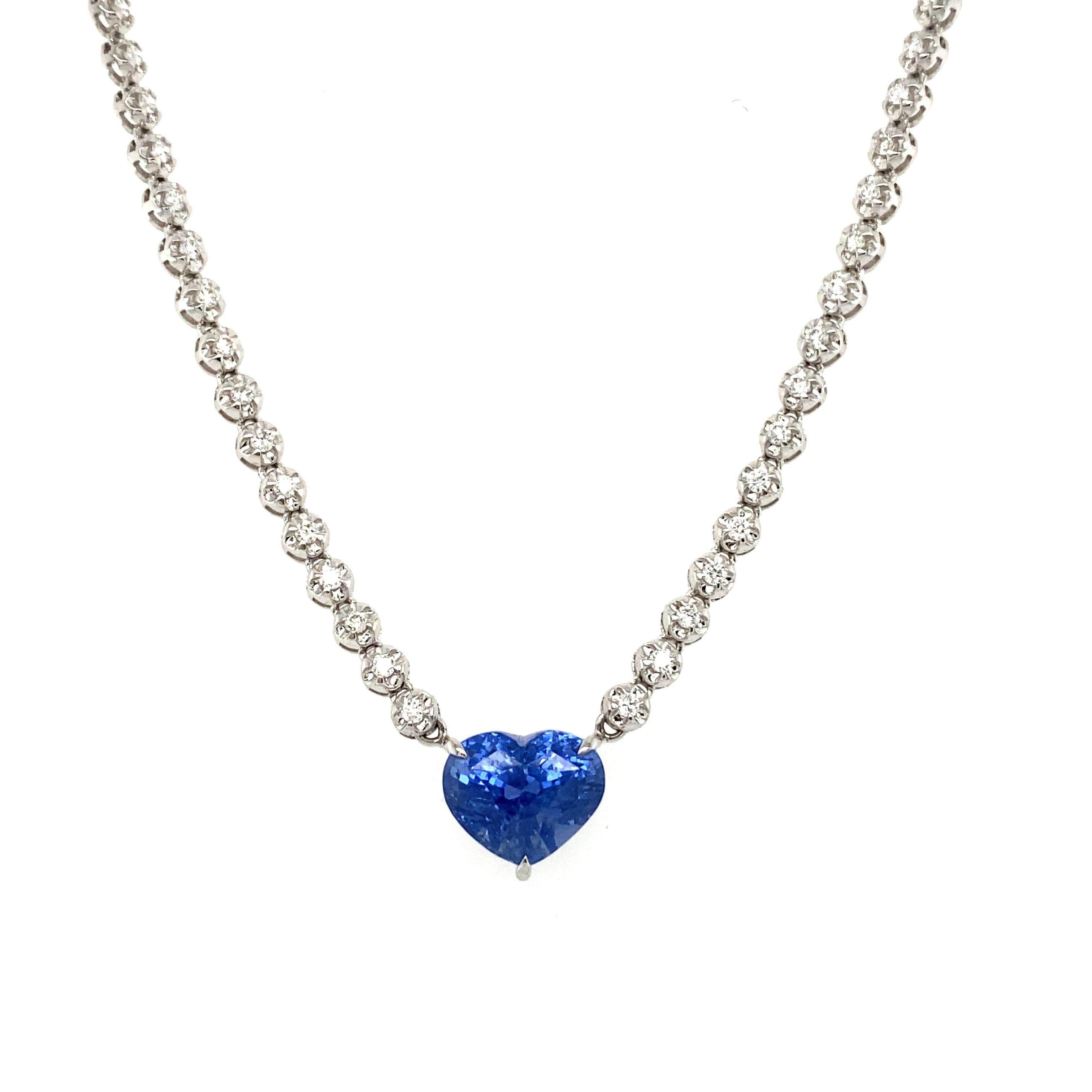 Ohhh la la. This Gorgeous Vintage 18K White Gold Diamond Tennis Rivera Necklace with Unheated Heart Sapphire is going to be hard to let go! It is truly an amazing piece. 
 
Crafted in solid 18K White Gold, this necklace features a classic diamond