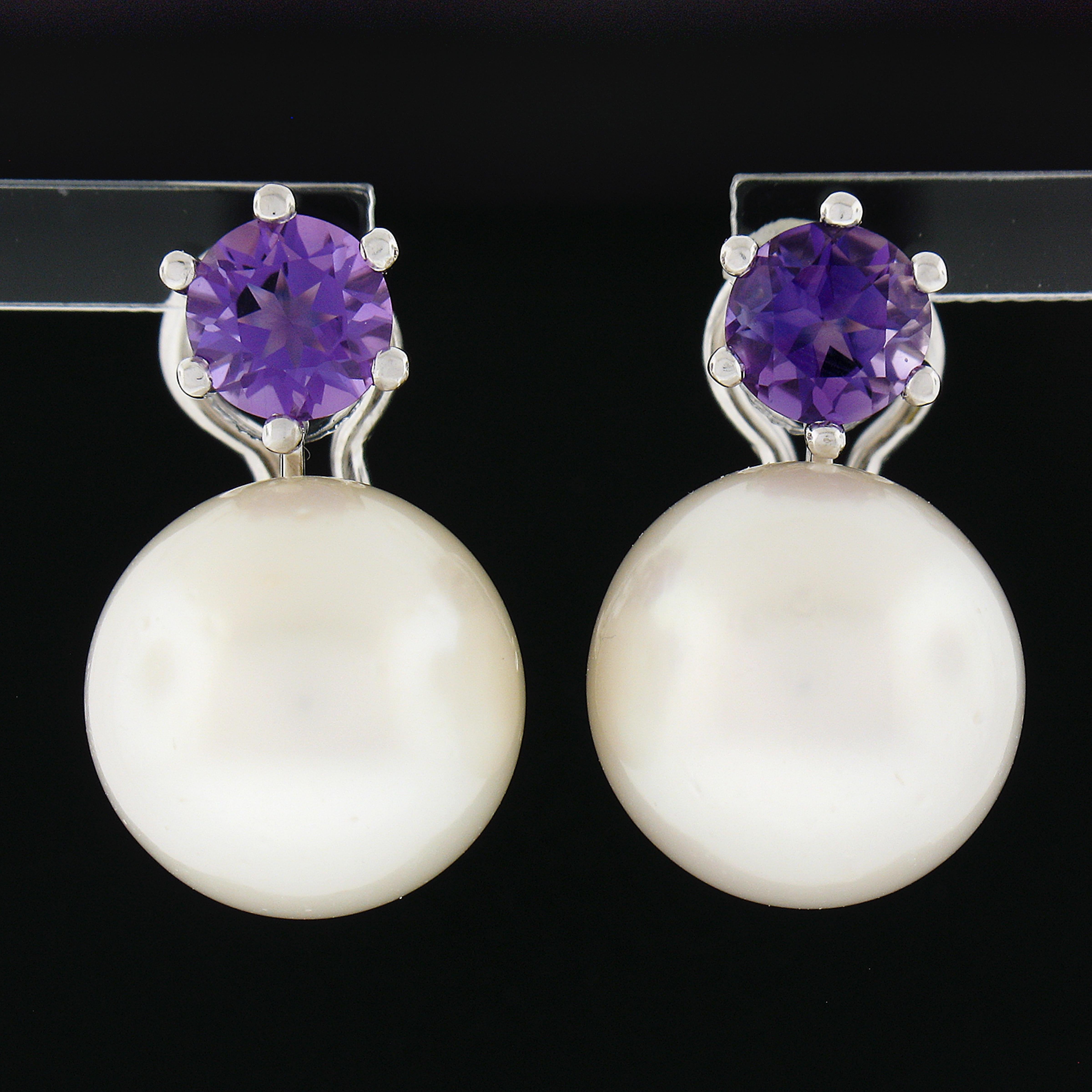 These lovely vintage drop earrings are crafted in solid 18k white gold and feature a simply elegant design with each carrying a very nice quality cultured pearl and natural amethyst stone. These fine pearls display an attractive large size on the