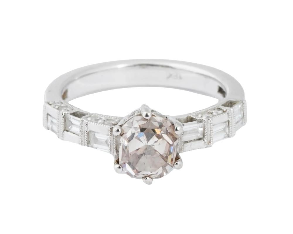 A vintage 18K white gold cocktail ring. The central cushion-cut pale pink morganite stone is flanked with baguette diamonds. Marked 18K on the inside. Total Weight: 5 grams. Elegant Jewelry For Women.

OVERALL GOOD VINTAGE CONDITION. REFER TO