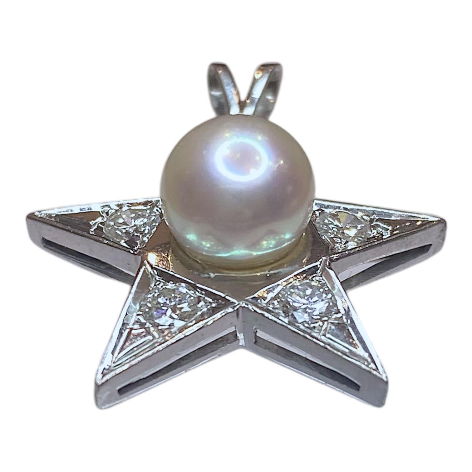 Crafted in 18K white gold, this pendant showcases a star-shaped design. At its center, a lustrous white cultured pearl is set, surrounded by brilliant-cut white diamonds. 
The pendant's sleek lines and polished finish enhance its contemporary