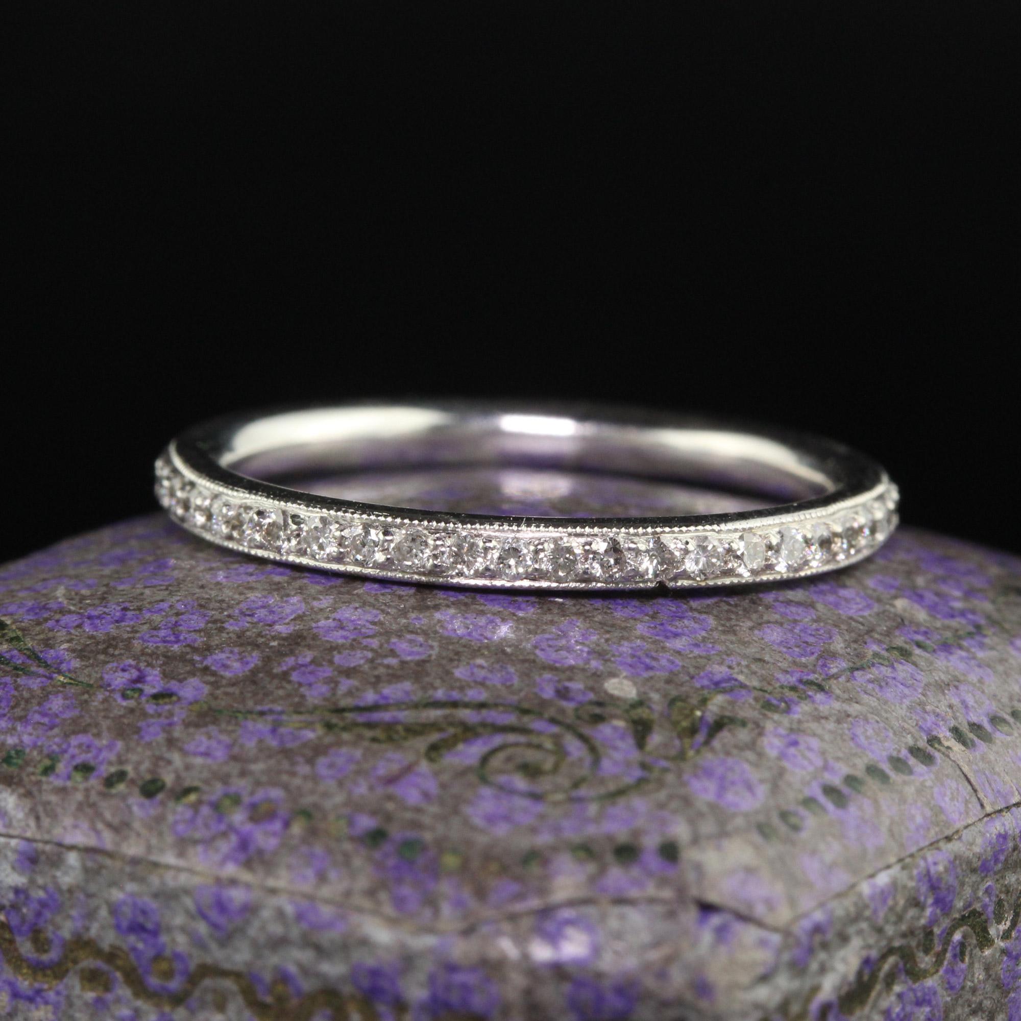 Beautiful Vintage 18K White Gold Round Cut Eternity Wedding Band - Size 7. This classic eternity wedding band is crafted in 18k white gold. There are round cut diamonds going around the entire ring and is in good condition. The ring is in good