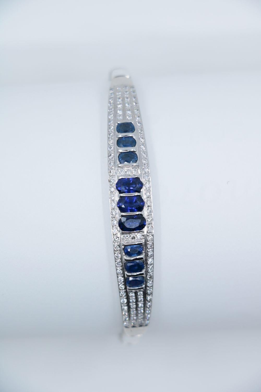 Vintage 18K White Gold Sapphire Diamond Bracelet

Marked:
18K

Approximate Dimensions:
17.7 cm (Length)
1 cm - 0.4 cm (Width)
6.07 mm x 3.40 mm - 3.87 mm x 2.56 mm (Sapphire) 
17.8 grams in weight.