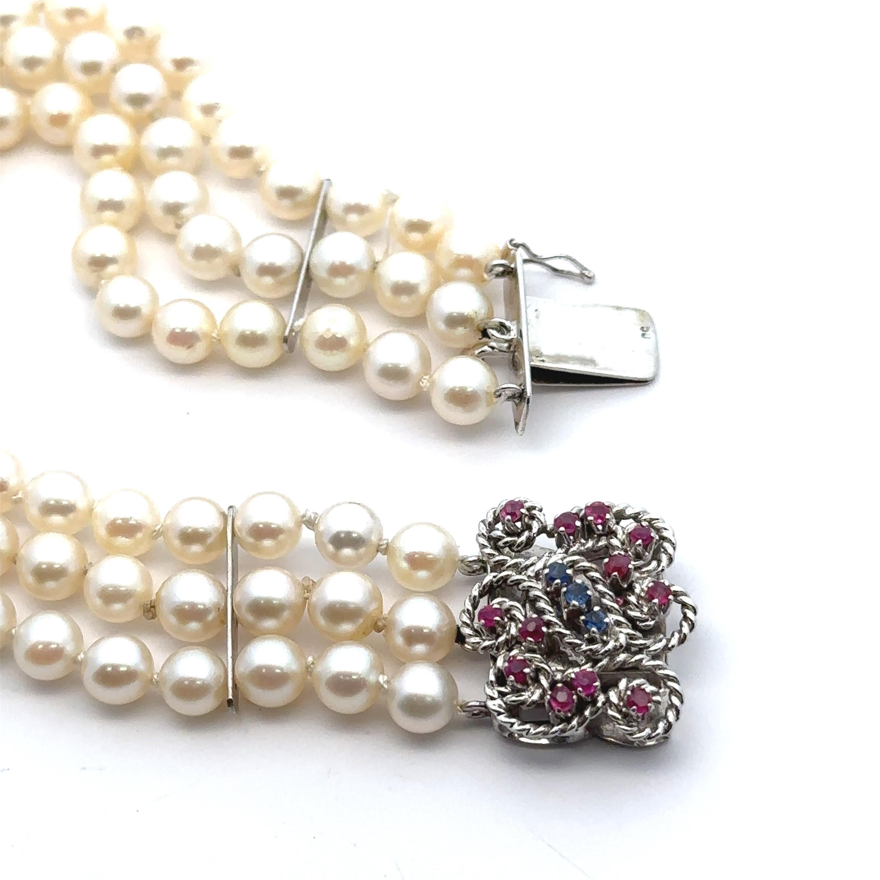 Vintage 18k White Gold Sapphire & Ruby Floral Clasp Three Strand Pearl Bracelet For Sale 1