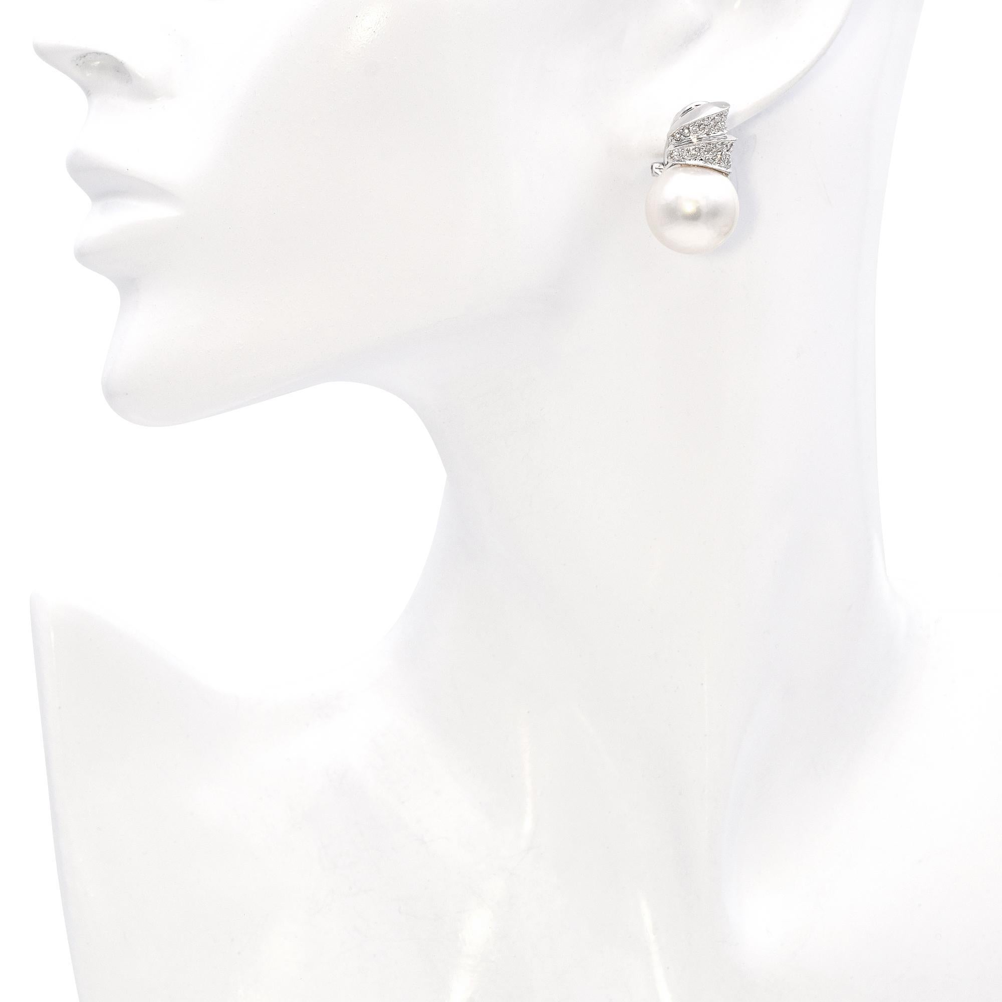 Elegant 18K White Gold Pearl and Diamond Drop Earrings. This exquisite pair features lustrous South Sea pearls complemented by round pavé set white diamonds. The earrings are crafted in 18k white gold, showcasing a modern design with a luxurious