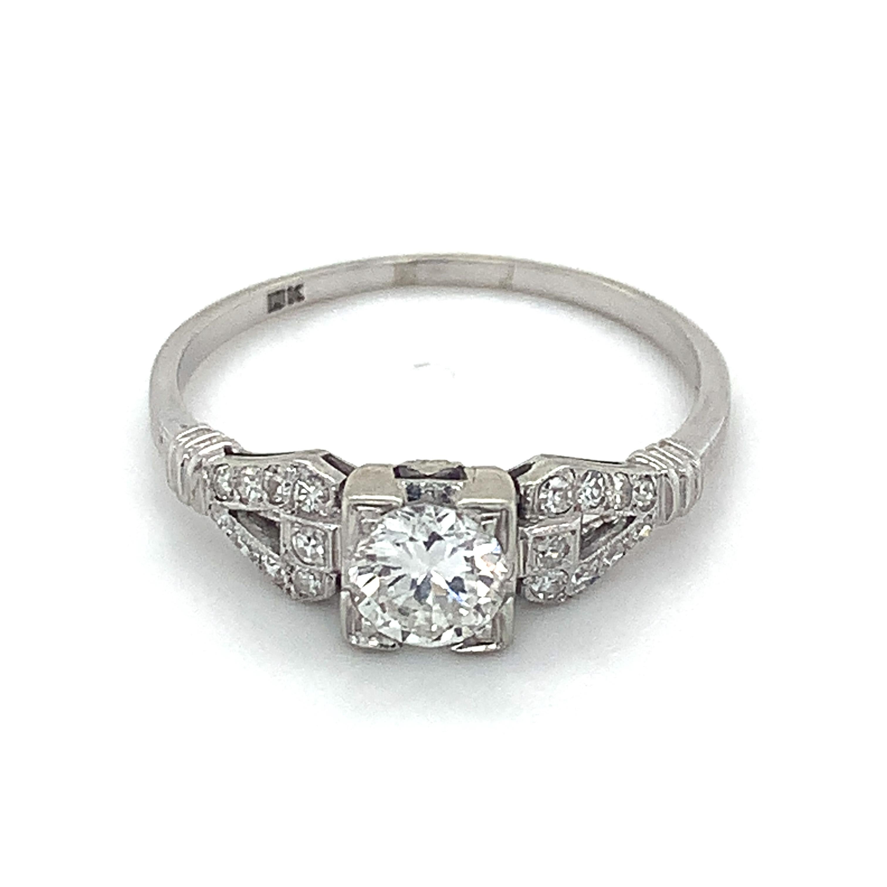 Antique 18k White Gold Round European Cut Center With Single Cut Diamond Ring 

Size 8.5

2.2 Grams

1 Round European Cut Diamond 5MM Approx .5 Carats 

Clarity VS2 Color: G-H

18 Round Single Cut Diamonds 0.18 Carats Total Weight

Color: G-H