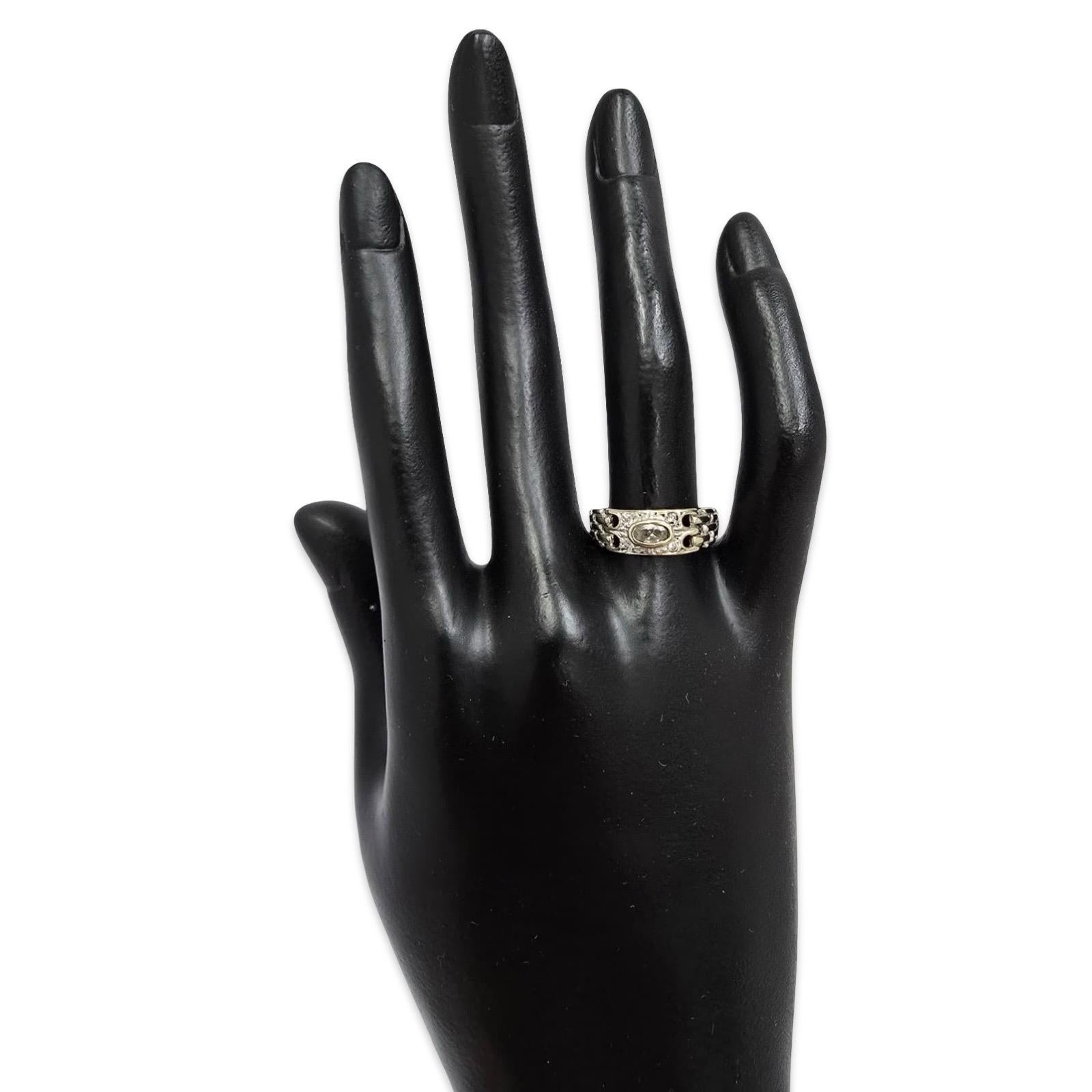 Vintage hand-crafted 18K white gold ring featuring an oval-cut rock crystal at center, framed by matching rock crystal accents in an intricate openwork woven band.

This unique European-style design blends a Deco-inspired geometric shank with